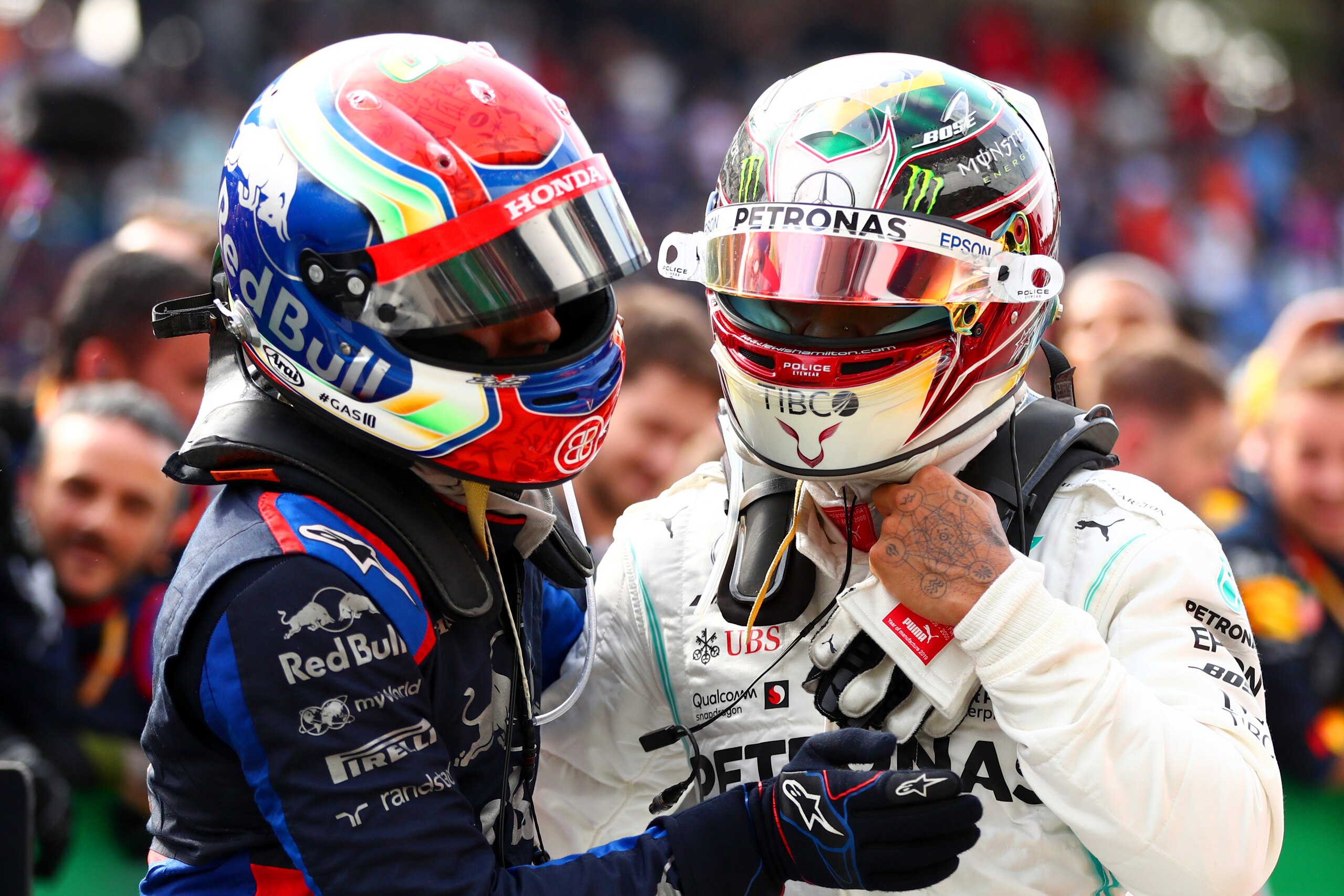 SAO PAULO, BRAZIL - NOVEMBER 17: Second placed Pierre Gasly of France and Scuderia Toro Rosso celebrates with third placed Lewis Hamilton of Great Britain and Mercedes GP in parc ferme during the F1 Grand Prix of Brazil at Autodromo Jose Carlos Pace on No