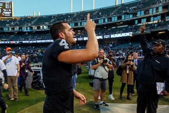 OAKLAND, CA - NOVEMBER 17: Quarterback Derek Carr #4 of the Oakland Raiders celebrates after the game against the Cincinnati Bengals at RingCentral Coliseum on November 17, 2019 in Oakland, California. The Oakland Raiders defeated the Cincinnati Bengals 1