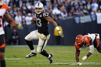 OAKLAND, CALIFORNIA - NOVEMBER 17: Darren Waller #83 of the Oakland Raiders runs the ball during the second half against the Cincinnati Bengals at RingCentral Coliseum on November 17, 2019 in Oakland, California. (Photo by Daniel Shirey/Getty Images)