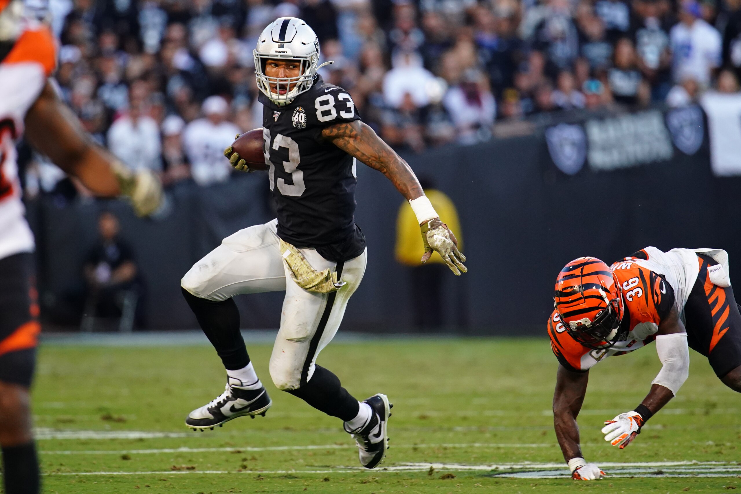 OAKLAND, CALIFORNIA - NOVEMBER 17: Darren Waller #83 of the Oakland Raiders runs the ball during the second half against the Cincinnati Bengals at RingCentral Coliseum on November 17, 2019 in Oakland, California. (Photo by Daniel Shirey/Getty Images)