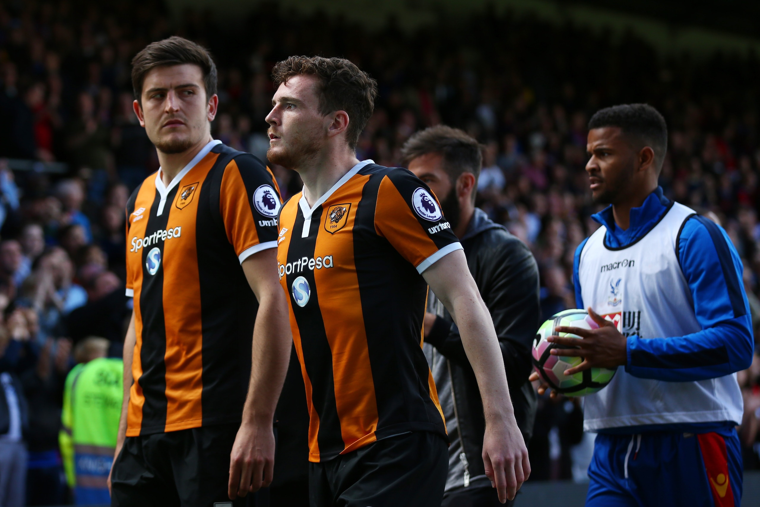 LONDON, ENGLAND - MAY 14: Harry Maguire of Hull City and Andrew Robertson of Hull City leave the pitch looking dejected after being relegated to the Championship after the Premier League match between Crystal Palace and Hull City at Selhurst Park on May 1