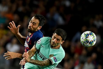 Barcelona's Spanish midfielder Sergio Busquets (L) vies with Inter Milan's Italian midfielder Stefano Sensi during the UEFA Champions League Group F football match between Barcelona and Inter Milan at the Camp Nou stadium in Barcelona, on October 2, 2019.