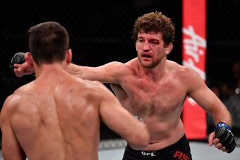 SINGAPORE, SINGAPORE - OCTOBER 26: (R-L) Ben Askren punches Demian Maia of Brazil in their welterweight bout during the UFC Fight Night event at Singapore Indoor Stadium on October 26, 2019 in Singapore. (Photo by Jeff Bottari/Zuffa LLC via Getty Images)