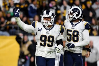 PITTSBURGH, PA - NOVEMBER 10: Aaron Donald #99 of the Los Angeles Rams celebrates with Cory Littleton #58 after sacking Mason Rudolph #2 of the Pittsburgh Steelers for a safety in the fourth quarter at Heinz Field on November 10, 2019 in Pittsburgh, Penns