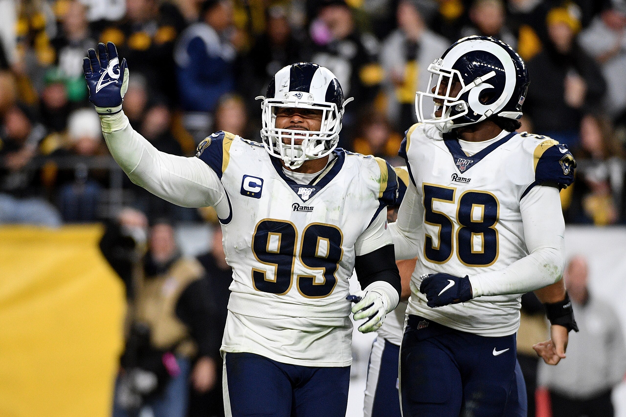 PITTSBURGH, PA - NOVEMBER 10: Aaron Donald #99 of the Los Angeles Rams celebrates with Cory Littleton #58 after sacking Mason Rudolph #2 of the Pittsburgh Steelers for a safety in the fourth quarter at Heinz Field on November 10, 2019 in Pittsburgh, Penns
