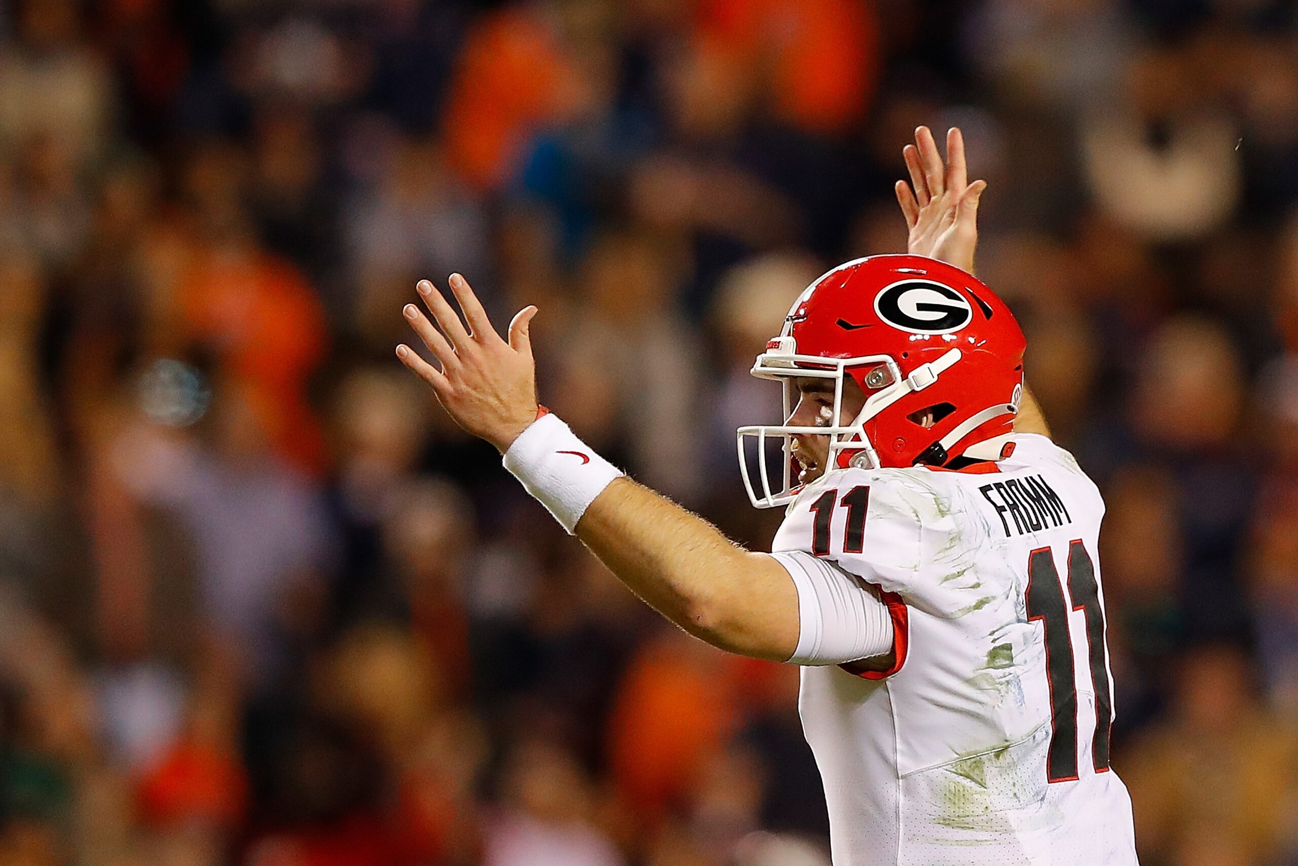 AUBURN, ALABAMA - NOVEMBER 16:  Jake Fromm #11 of the Georgia Bulldogs reacts after passing for a touchdown to Eli Wolf #17 in the second half against the Auburn Tigers at Jordan-Hare Stadium on November 16, 2019 in Auburn, Alabama. (Photo by Kevin C. Cox