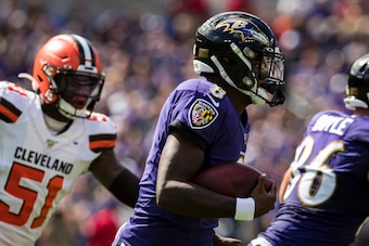 BALTIMORE, MD - SEPTEMBER 29: Lamar Jackson #8 of the Baltimore Ravens scrambles against the Cleveland Browns during the first half at M&T Bank Stadium on September 29, 2019 in Baltimore, Maryland. (Photo by Scott Taetsch/Getty Images)