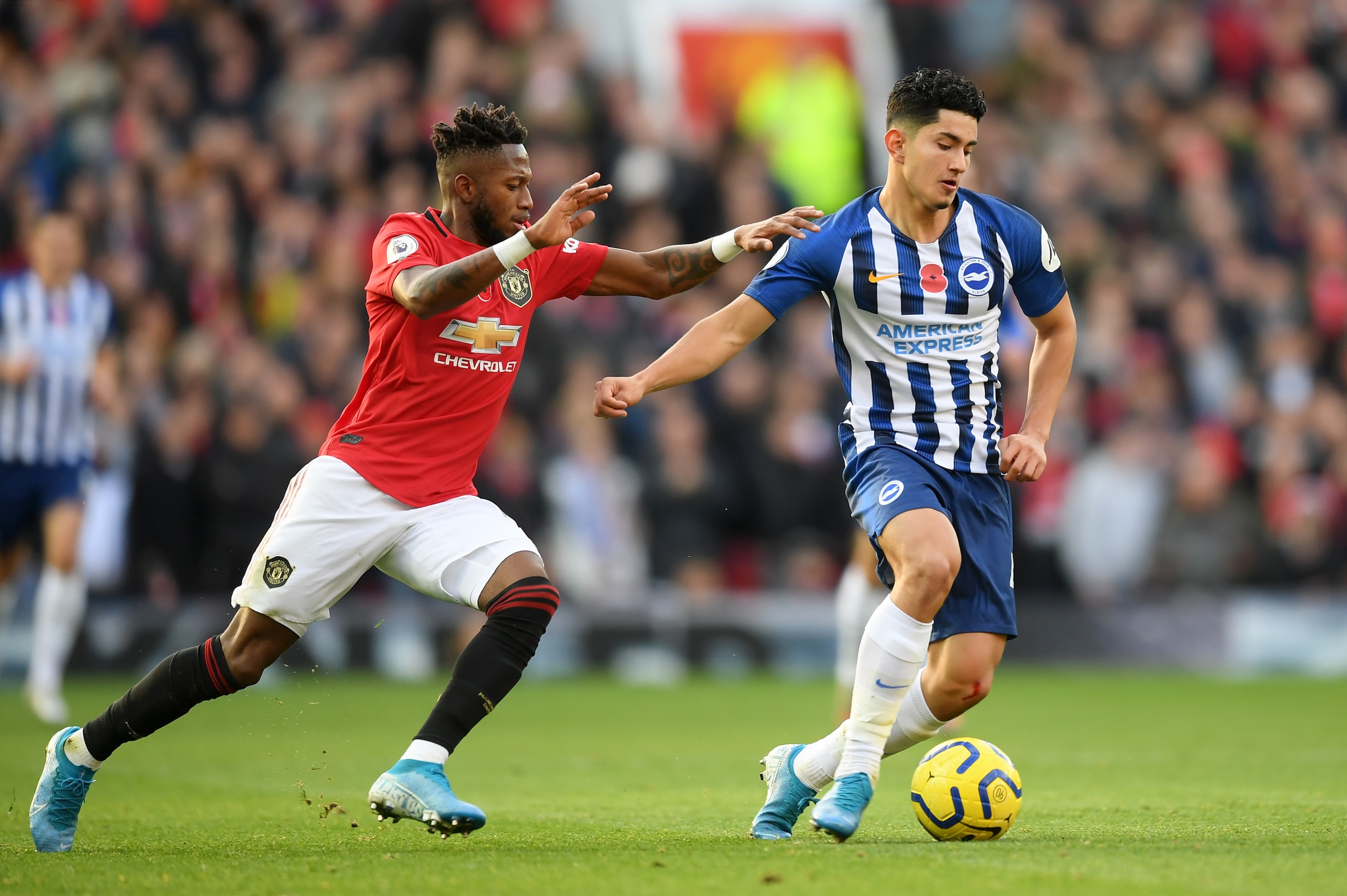 MANCHESTER, ENGLAND - NOVEMBER 10: Steven Alzate of Brighton and Hove Albion battles for possession with Fred of Manchester United during the Premier League match between Manchester United and Brighton & Hove Albion at Old Trafford on November 10, 2019 in