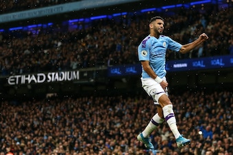 MANCHESTER, ENGLAND - NOVEMBER 23: Riyad Mahrez of Manchester City celebrates after scoring a goal to make it 2-1 during the Premier League match between Manchester City and Chelsea FC at Etihad Stadium on November 23, 2019 in Manchester, United Kingdom. 