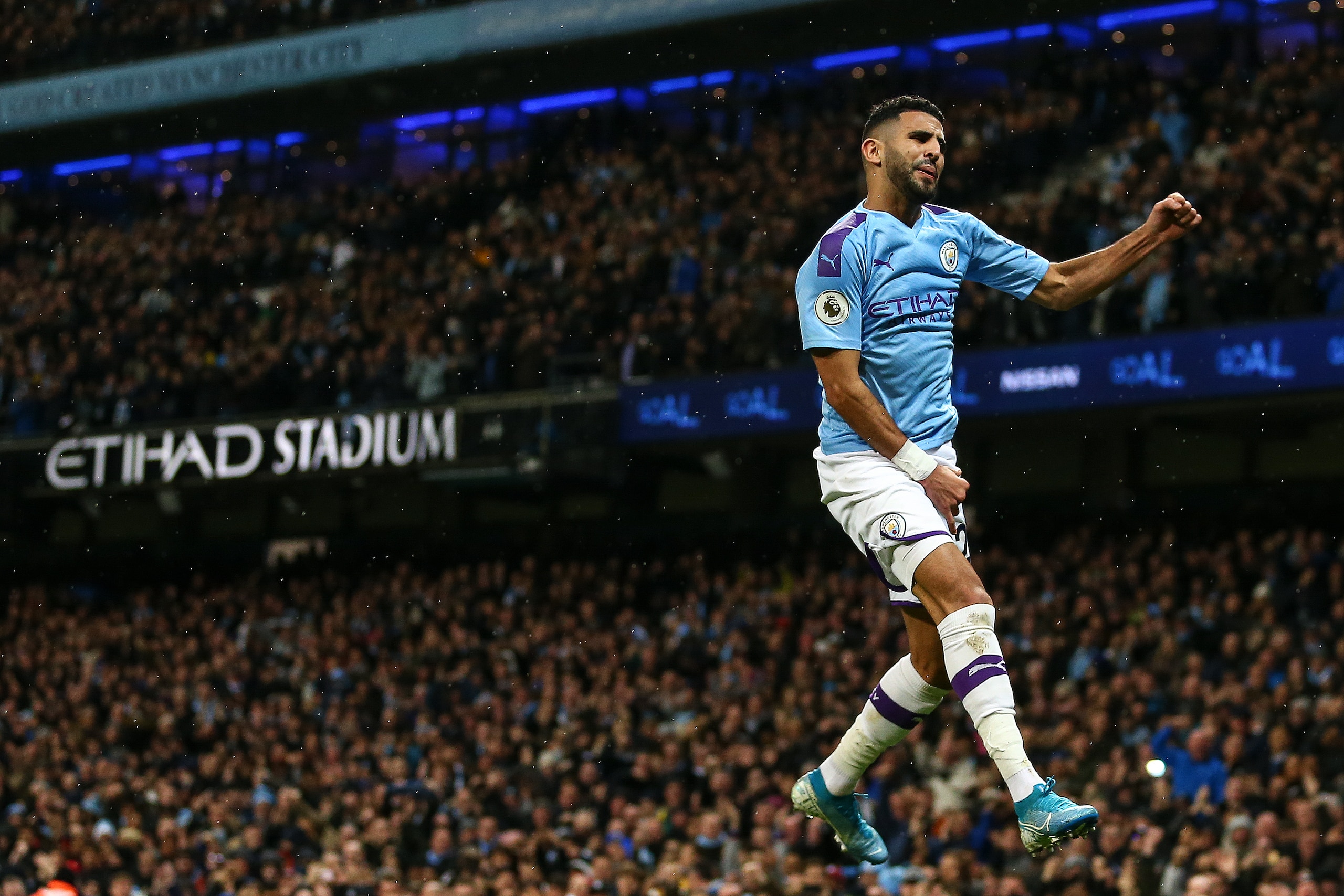 MANCHESTER, ENGLAND - NOVEMBER 23: Riyad Mahrez of Manchester City celebrates after scoring a goal to make it 2-1 during the Premier League match between Manchester City and Chelsea FC at Etihad Stadium on November 23, 2019 in Manchester, United Kingdom. 