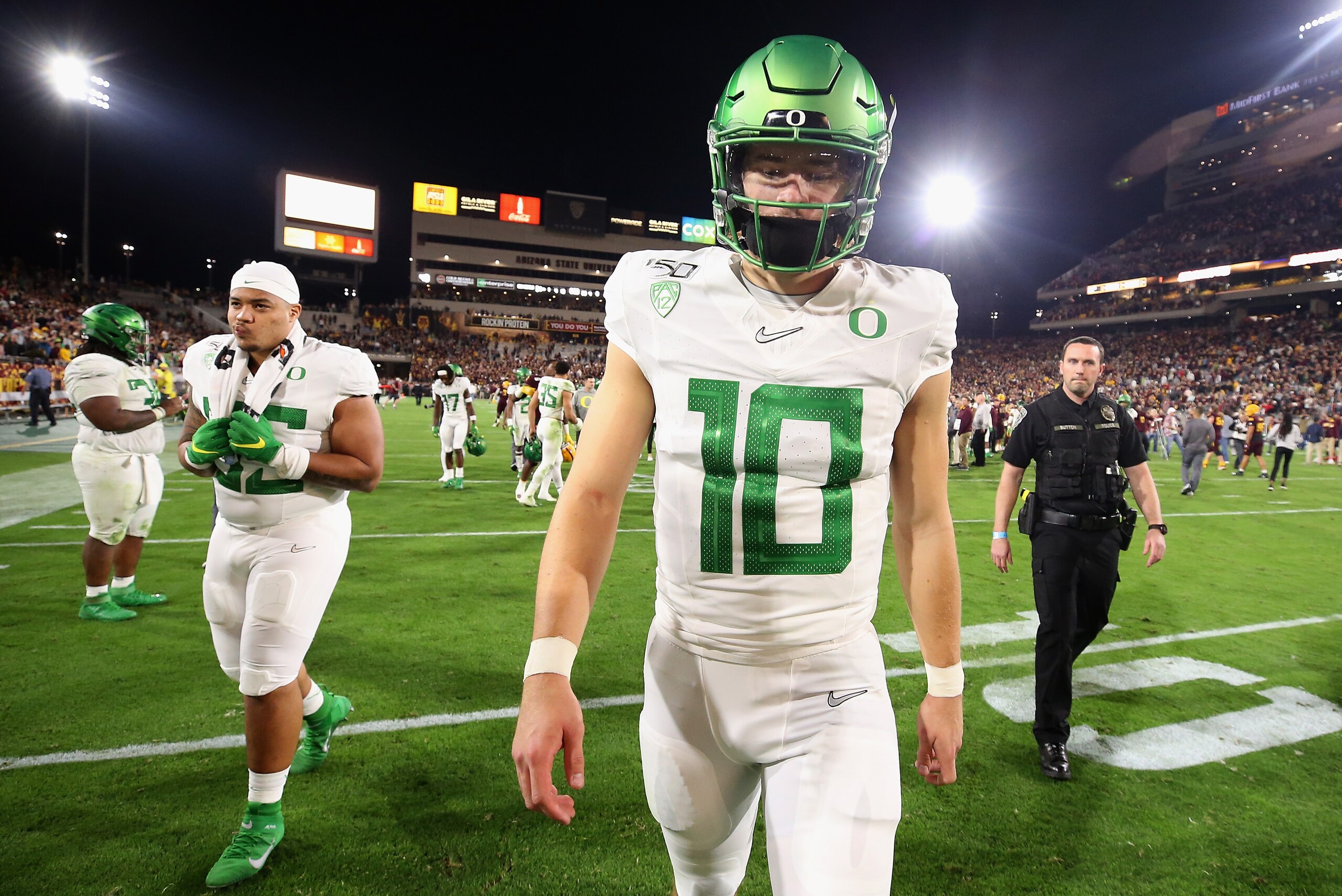 TEMPE, ARIZONA - NOVEMBER 23: Quarterback Justin Herbert #10 of the Oregon Ducks walks off the field after being defeated by the Arizona State Sun Devils in NCAAF game at Sun Devil Stadium on November 23, 2019 in Tempe, Arizona. The Sun Devils defeated th