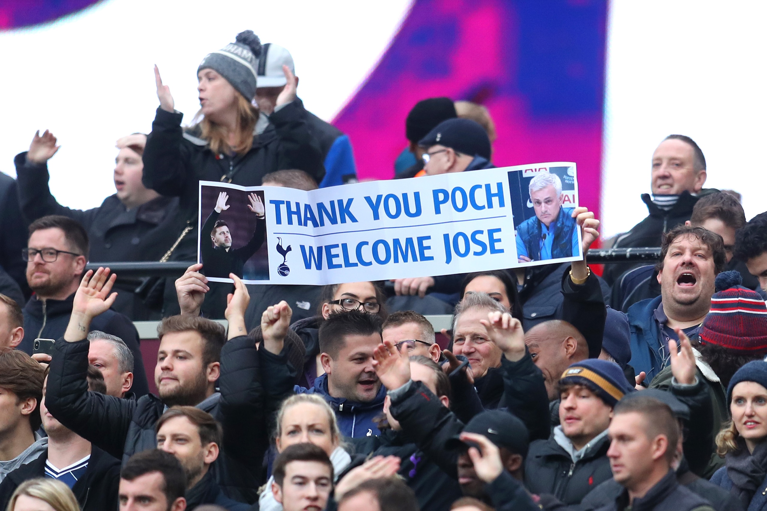 LONDON, ENGLAND - NOVEMBER 23: a Tottenham fan holds up a banner about Jose Mourinho and Mauricio Pocchetino during the Premier League match between West Ham United and Tottenham Hotspur at London Stadium on November 23, 2019 in London, United Kingdom. (P