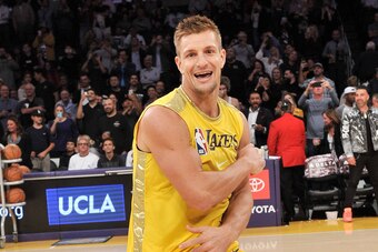 LOS ANGELES, CALIFORNIA - NOVEMBER 19: Rob Gronkowski dances with the Laker Girls during halftime at a basketball game between the Los Angeles Lakers and the Oklahoma City Thunder at Staples Center on November 19, 2019 in Los Angeles, California. (Photo b