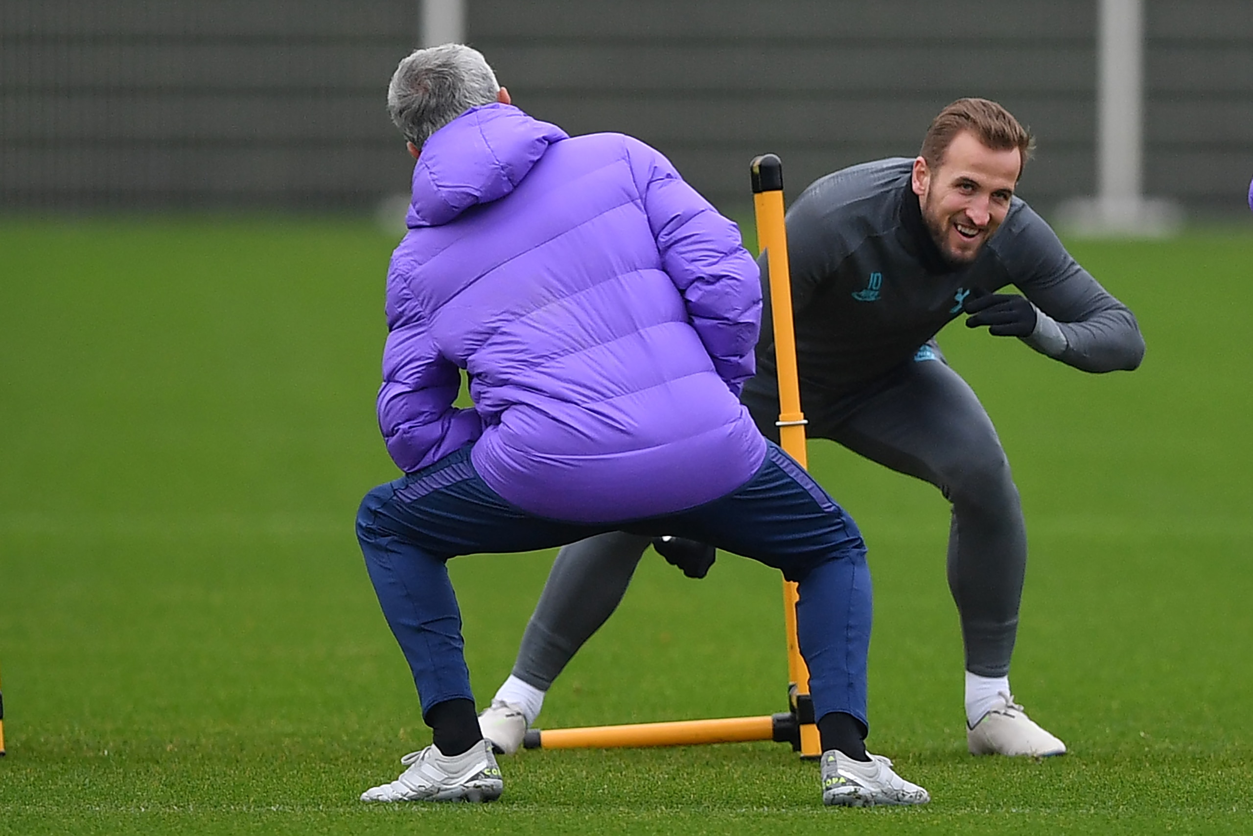 Tottenham Hotspur's English striker Harry Kane (R) and Tottenham Hotspur's Portuguese head coach Jose Mourinho (L) take part in a team training session at Tottenham Hotspur's Enfield Training Centre, in north London on November 25, 2019, ahead of their UE