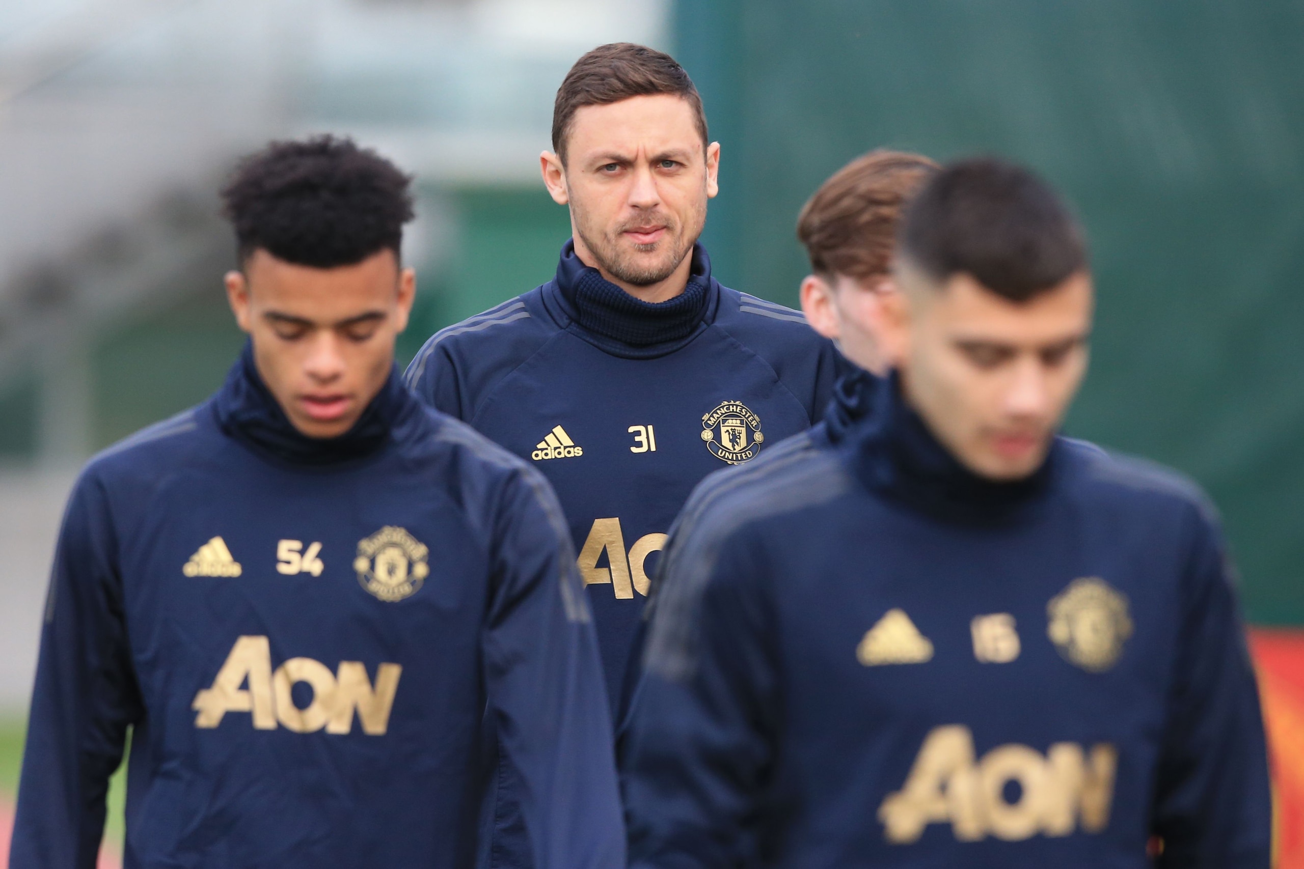 Manchester United's Serbian midfielder Nemanja Matic (C) takes part in a training session at the Carrington Training complex in Manchester, north west England on the eve of their Champions league group stage football match against Valencia on December 11,