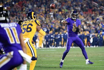 LOS ANGELES, CALIFORNIA - NOVEMBER 25:  Quarterback Lamar Jackson #8 of the Baltimore Ravens delivers a pass against the Los Angeles Rams at Los Angeles Memorial Coliseum on November 25, 2019 in Los Angeles, California. (Photo by Sean M. Haffey/Getty Imag