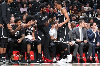 BROOKLYN, NY - OCTOBER 4: Kyrie Irving #11 of the Brooklyn Nets high-fives Spencer Dinwiddie #8 of the Brooklyn Nets against the the Basketball Club of Brazil on October 4, 2019 at Barclays Center in Brooklyn, New York. NOTE TO USER: User expressly acknow