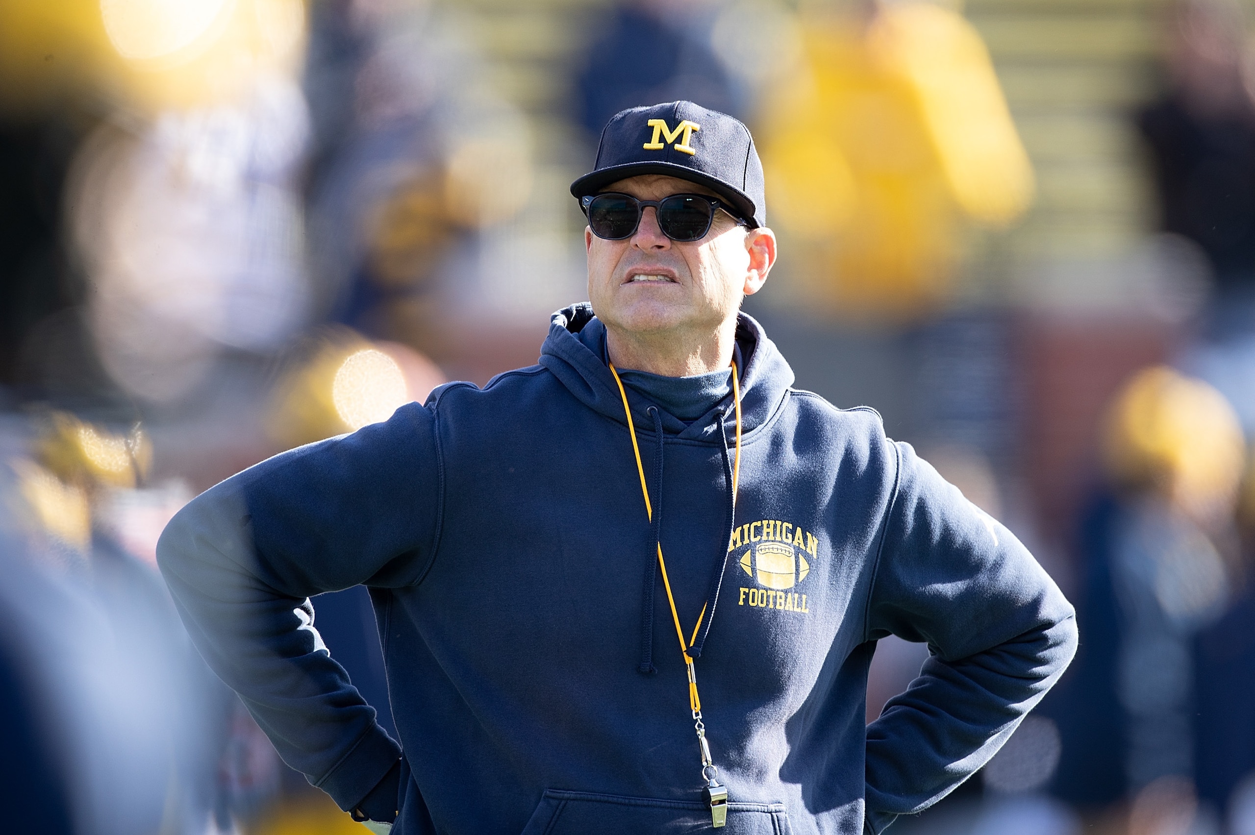 ANN ARBOR, MI - NOVEMBER 16: Michigan Wolverines head football coach Jim Harbaugh watches the pregame warm ups prior to the start of the game against the Michigan State Spartans at Michigan Stadium on November 16, 2019 in Ann Arbor, Michigan.  (Photo by L
