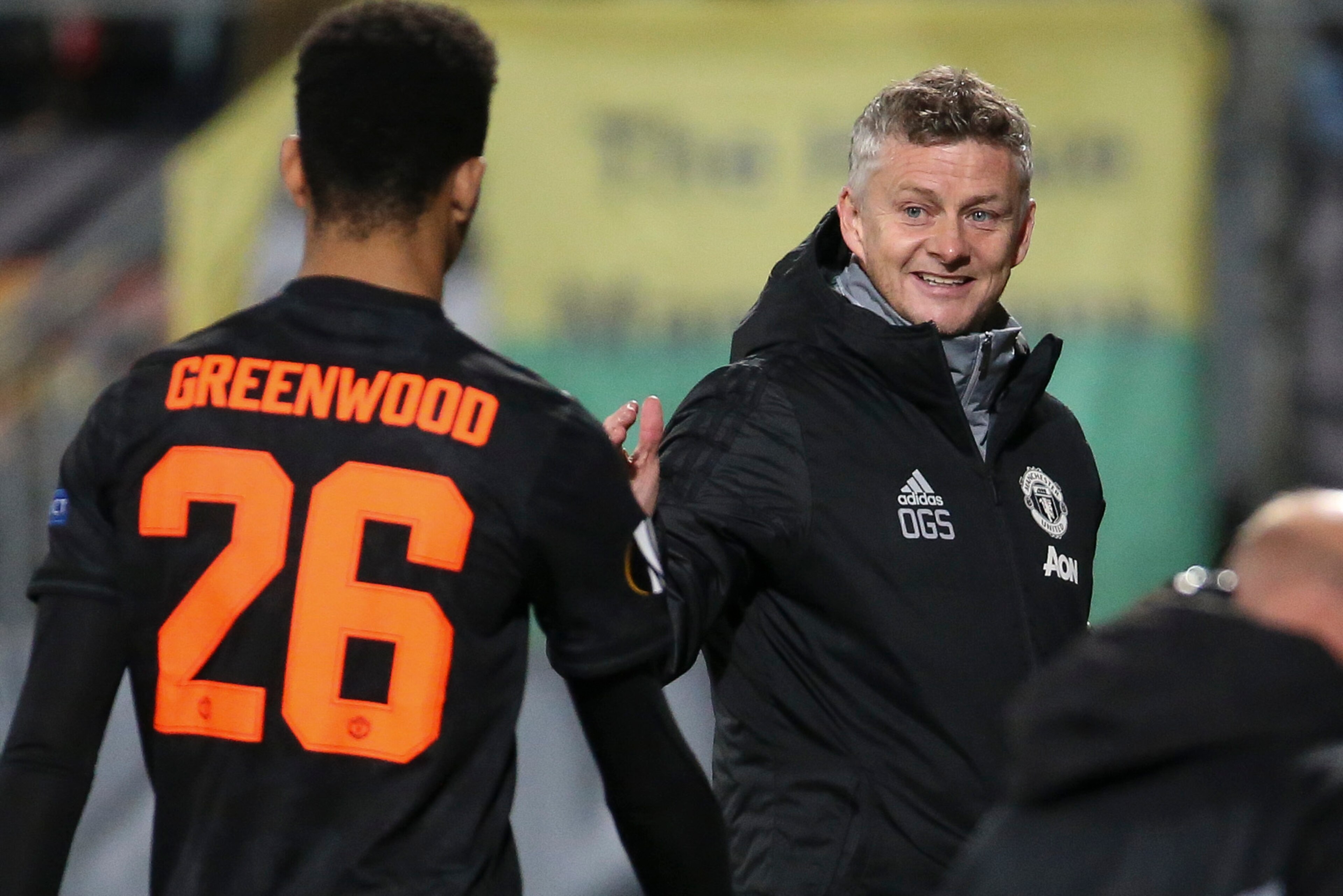 THE HAGUE, NETHERLANDS - OCTOBER 3: Coach of Manchester United Ole Gunnar Solskjaer greets Mason Greenwood of Manchester United when he's replaced during the UEFA Europa League group L match between AZ Alkmaar and Manchester United (Man U) at ADO Den Haag