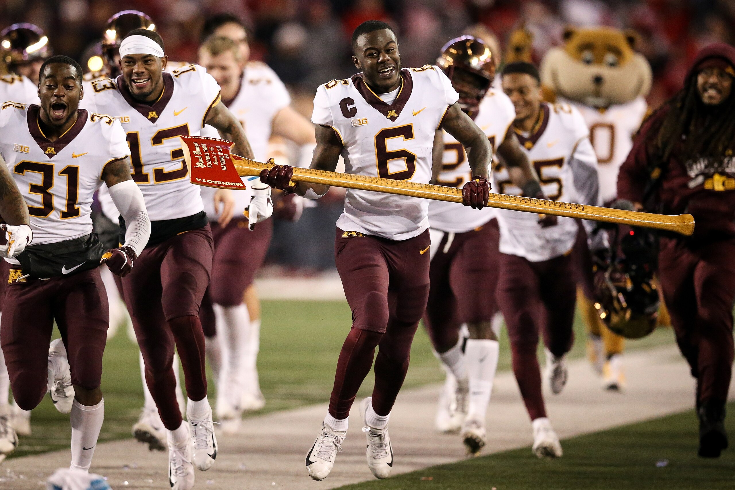 MADISON, WISCONSIN - NOVEMBER 24:  Tyler Johnson #6 of the Minnesota Golden Gophers celebrates with Paul Bunyan's Axe after beating the Wisconsin Badgers 37-15 at Camp Randall Stadium on November 24, 2018 in Madison, Wisconsin. (Photo by Dylan Buell/Getty