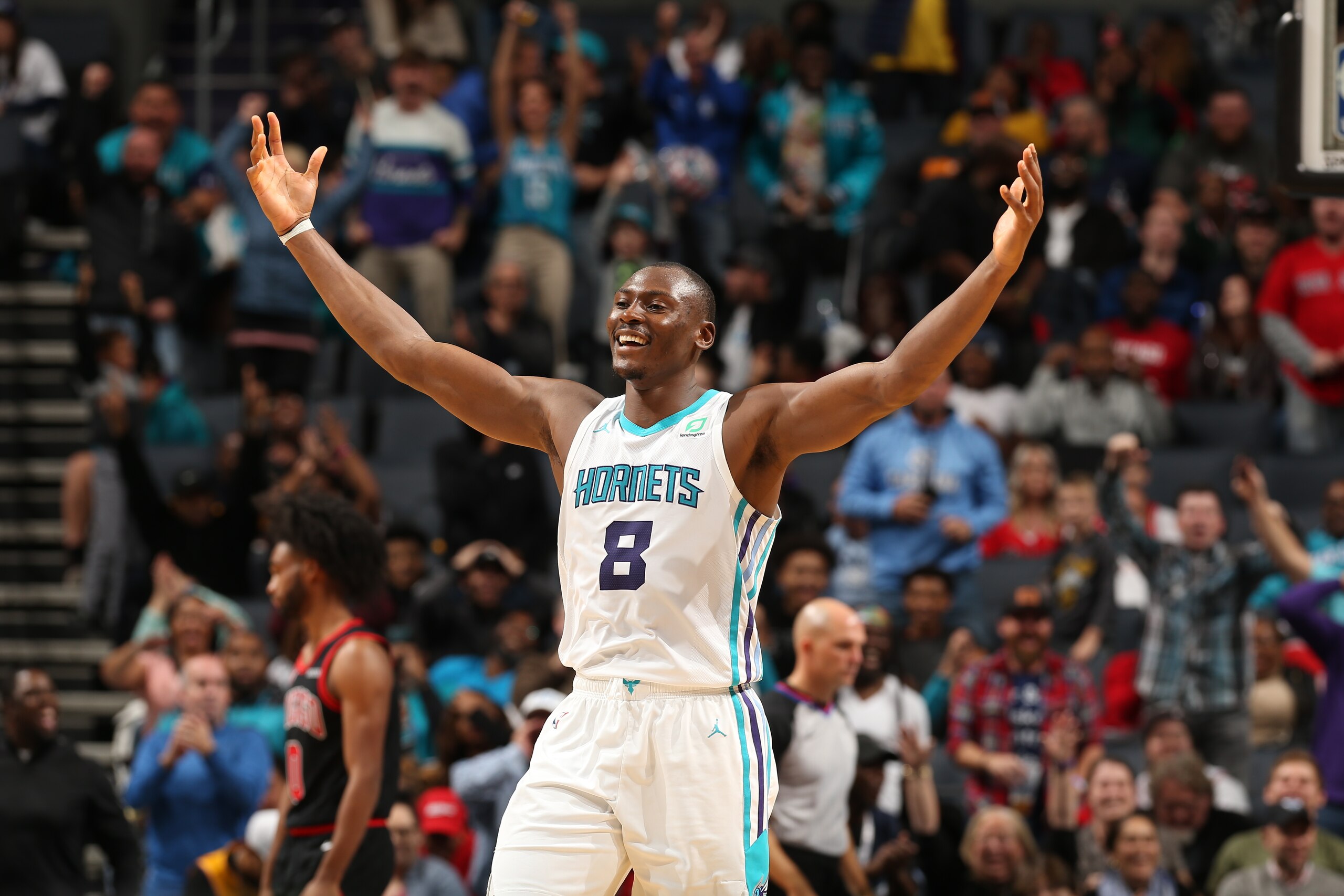CHARLOTTE, NC - NOVEMBER 23: Bismack Biyombo #8 of the Charlotte Hornets reacts to a play against the Chicago Bulls on November 23, 2019 at Spectrum Center in Charlotte, North Carolina. NOTE TO USER: User expressly acknowledges and agrees that, by downloa