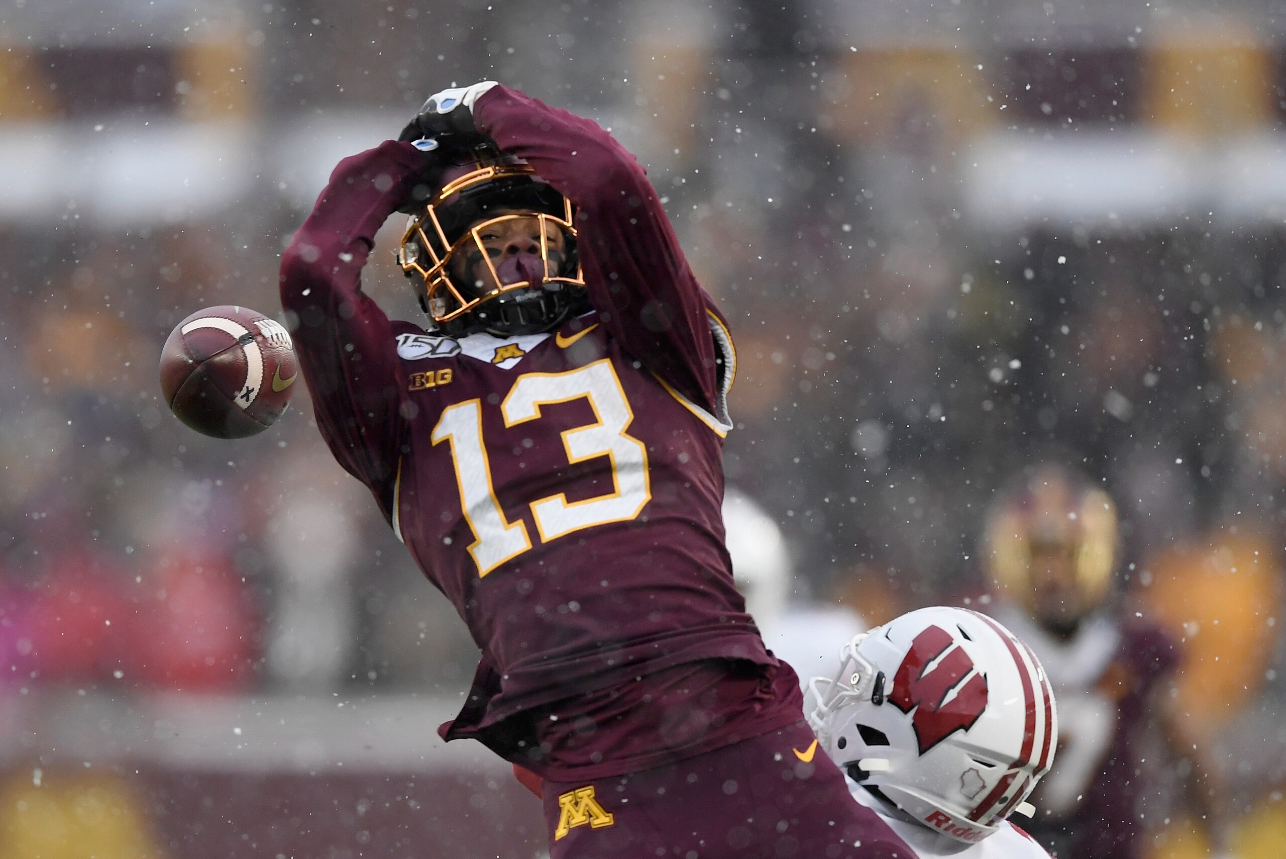 MINNEAPOLIS, MINNESOTA - NOVEMBER 30: Eric Burrell #25 of the Wisconsin Badgers breaks up a pass intended for Rashod Bateman #13 of the Minnesota Golden Gophers during the second quarter of the game at TCF Bank Stadium on November 30, 2019 in Minneapolis,