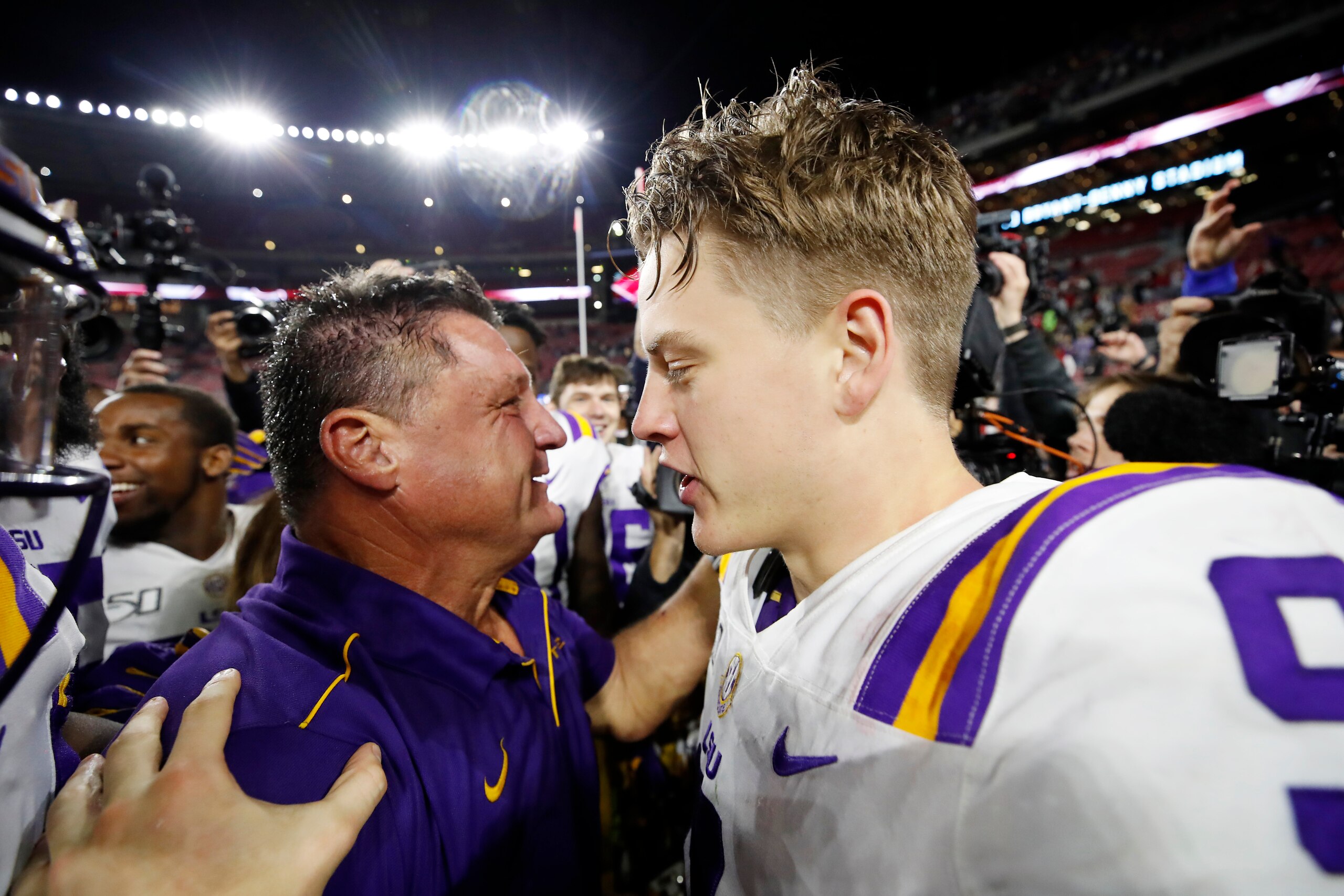 TUSCALOOSA, ALABAMA - NOVEMBER 09: Joe Burrow #9 of the LSU Tigers celebrates with head coach Ed Orgeron after defeating the Alabama Crimson Tide 46-41 at Bryant-Denny Stadium on November 09, 2019 in Tuscaloosa, Alabama. (Photo by Todd Kirkland/Getty Imag