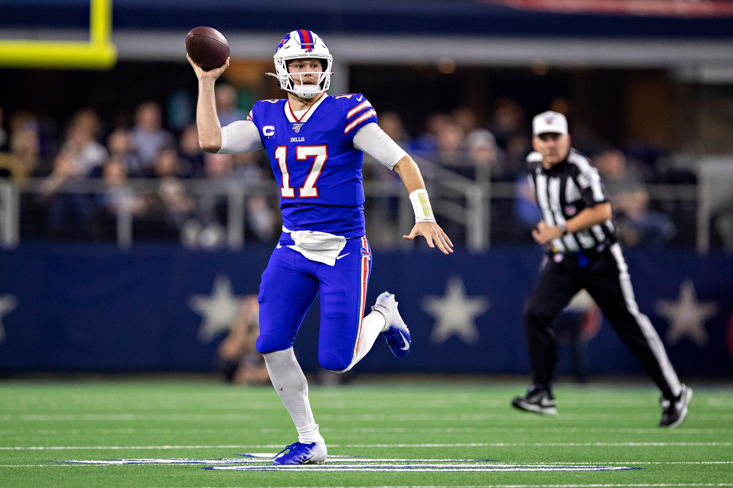 ARLINGTON, TX - NOVEMBER 28:  Josh Allen #17 of the Buffalo Bills rolls out to throw a pass in the second half of a game on Thanksgiving Day against the Dallas Cowboys at NRG Stadium on November 28, 2019 in Arlington, Texas.  The Bills defeated the Cowboy