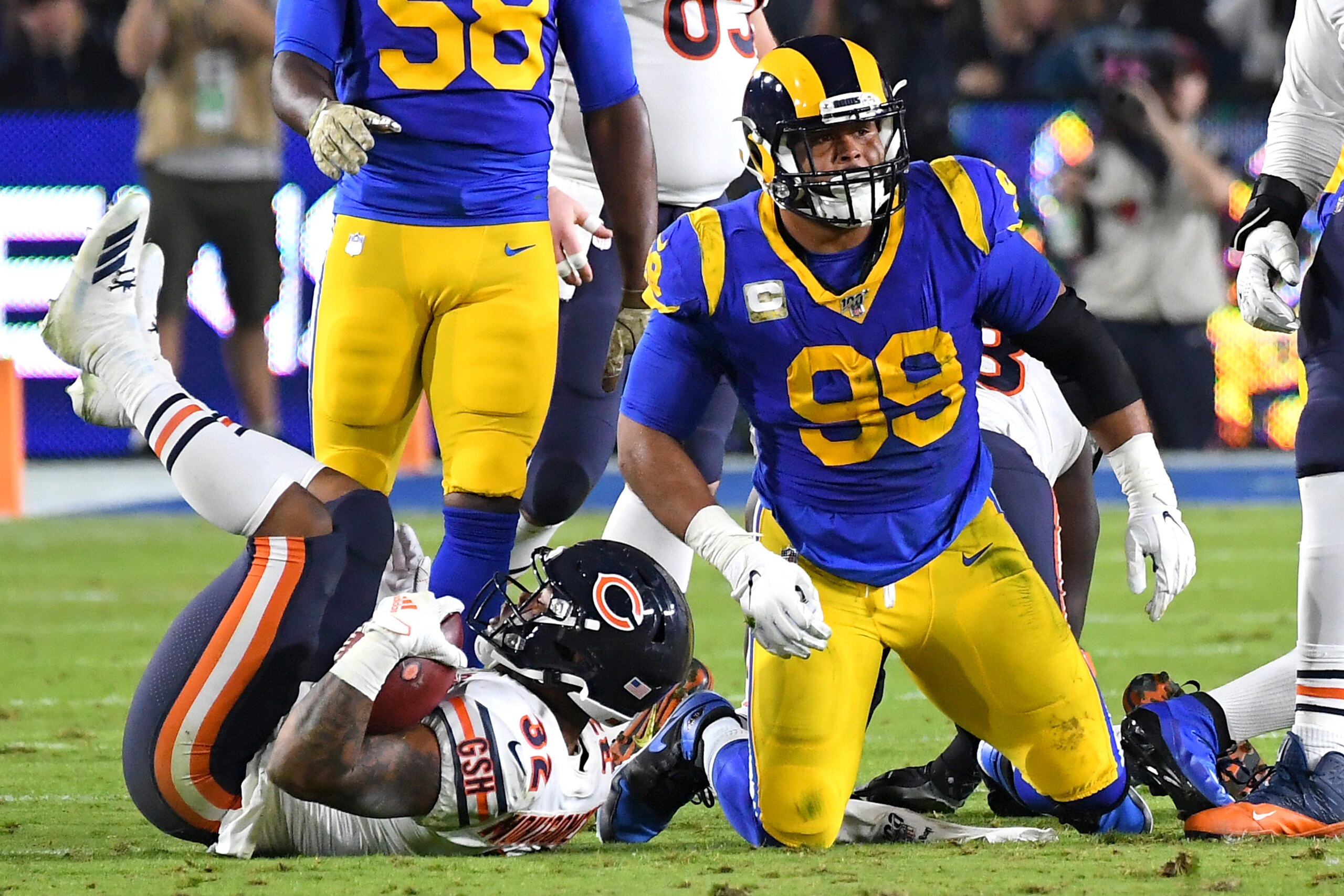 LOS ANGELES, CA - NOVEMBER 17: Defensive tackle Aaron Donald #99 of the Los Angeles Rams stops running back running back David Montgomery #32 of the Chicago Bears at the line of scrimmage age in the first half of the game at the Los Angeles Memorial Colis