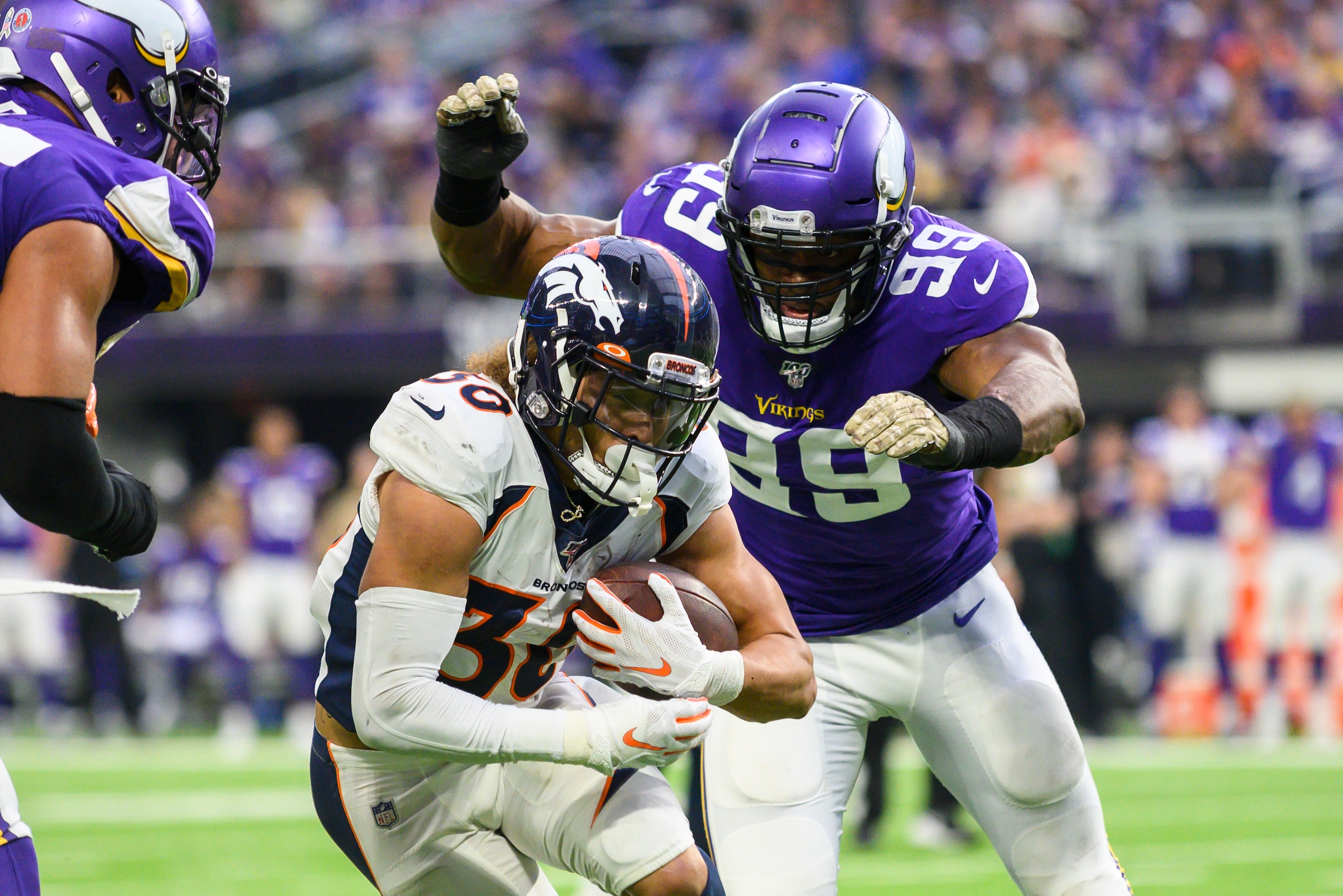 MINNEAPOLIS, MN - NOVEMBER 17: Phillip Lindsay #30 of the Denver Broncos runs with the ball in the first quarter of the game against the Minnesota Vikings at U.S. Bank Stadium on November 17, 2019 in Minneapolis, Minnesota. (Photo by Stephen Maturen/Getty