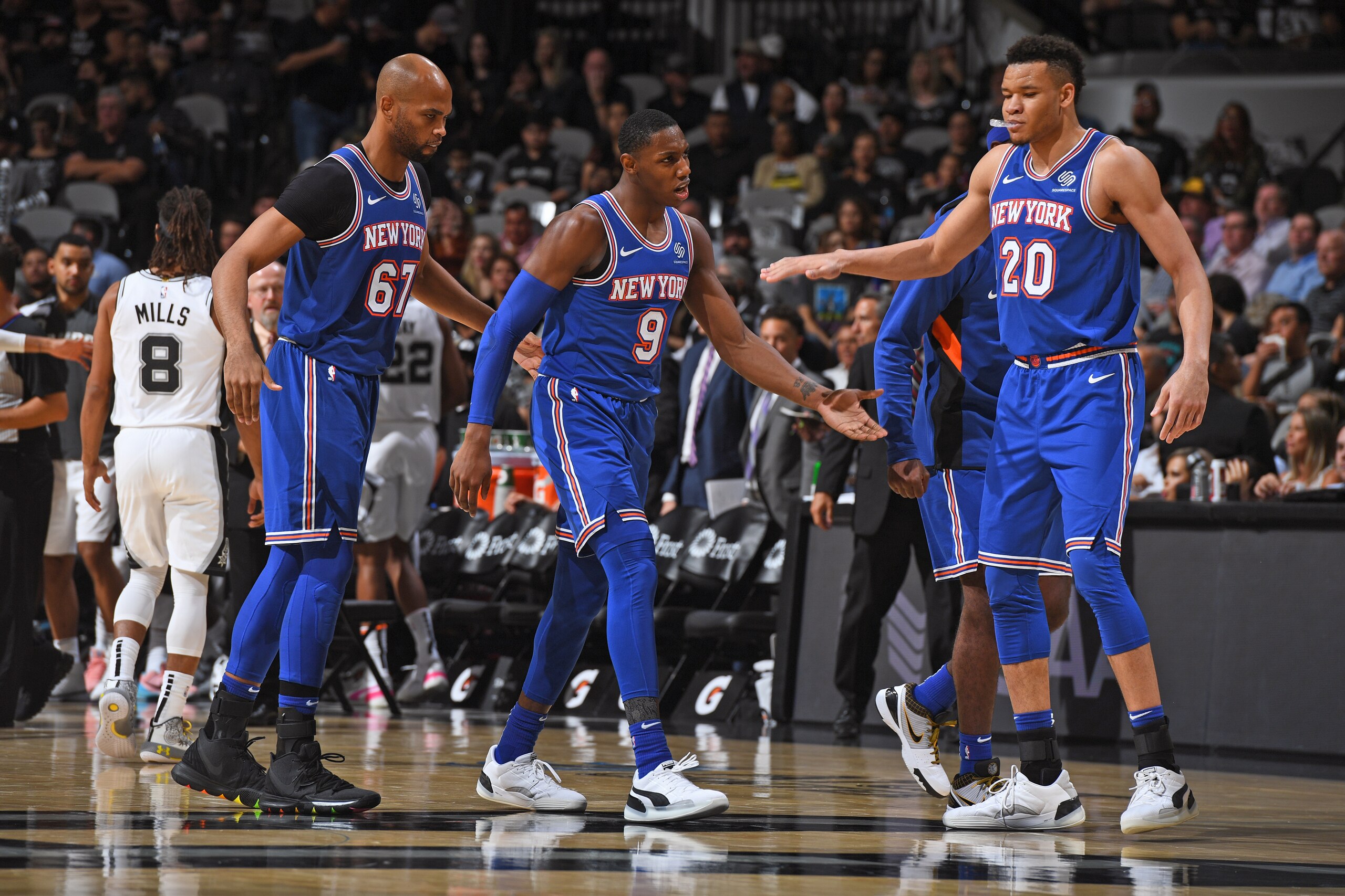 SAN ANTONIO, TX - OCTOBER 23: Kevin Knox #20 and RJ Barrett #9 of the New York Knicks high five after a dunk against the San Antonio Spurs on October 23, 2019 at the AT&T Center in San Antonio, Texas. NOTE TO USER: User expressly acknowledges and agrees t