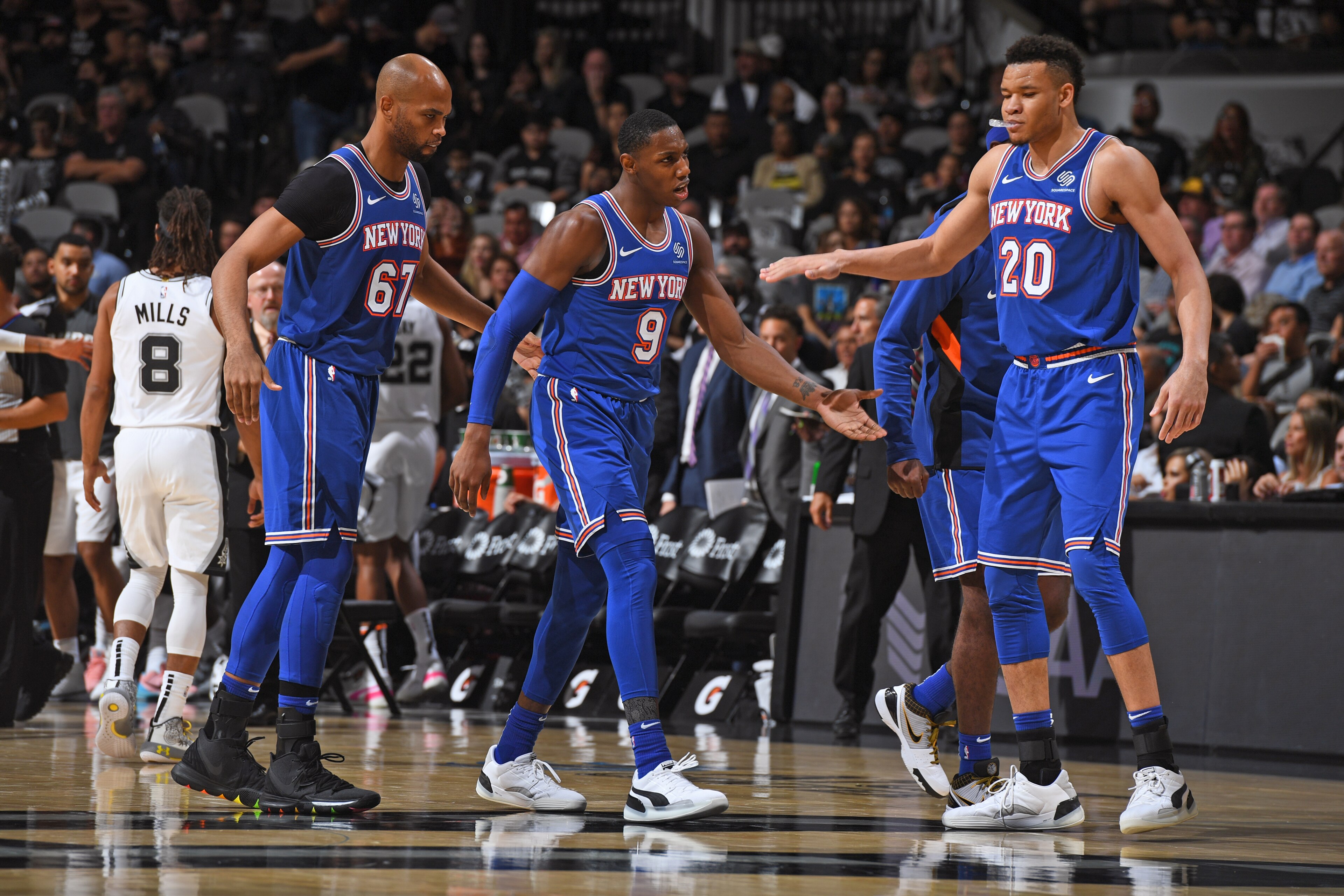 SAN ANTONIO, TX - OCTOBER 23: Kevin Knox #20 and RJ Barrett #9 of the New York Knicks high five after a dunk against the San Antonio Spurs on October 23, 2019 at the AT&T Center in San Antonio, Texas. NOTE TO USER: User expressly acknowledges and agrees t