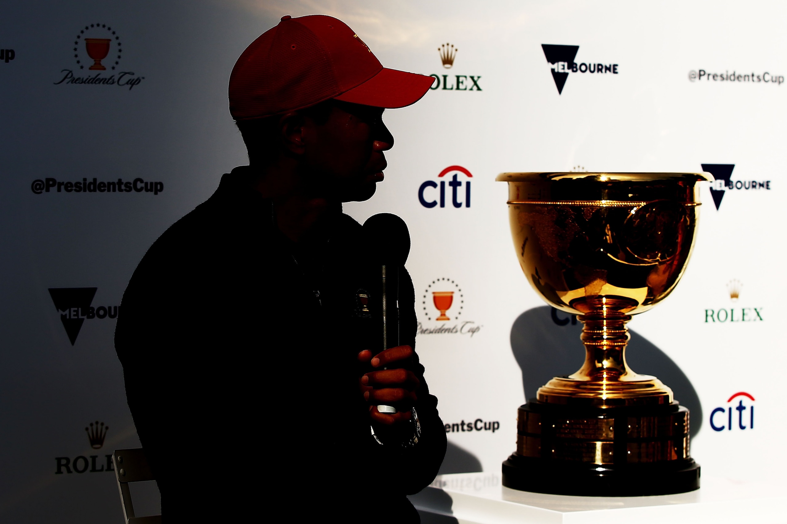 MELBOURNE, AUSTRALIA - DECEMBER 06:  Tiger Woods speaks next to the Presidents Cup during a Presidents Cup media opportunity at the Yarra Promenade on December 5, 2018 in Melbourne, Australia. The Presidents Cup 2019 will be held on December 9-15, 2019, w