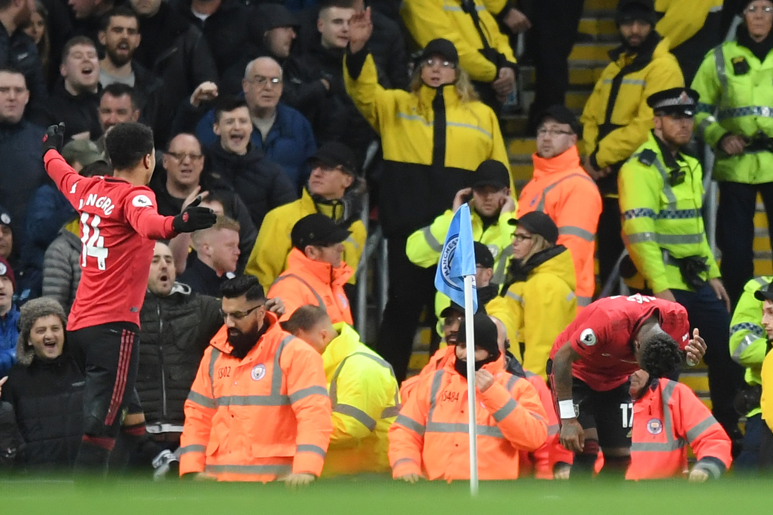 MANCHESTER, ENGLAND - DECEMBER 07: Fred of Manchester United reacts after being struck by an item thrown by the Manchester City fans during the Premier League match between Manchester City and Manchester United at Etihad Stadium on December 07, 2019 in Ma