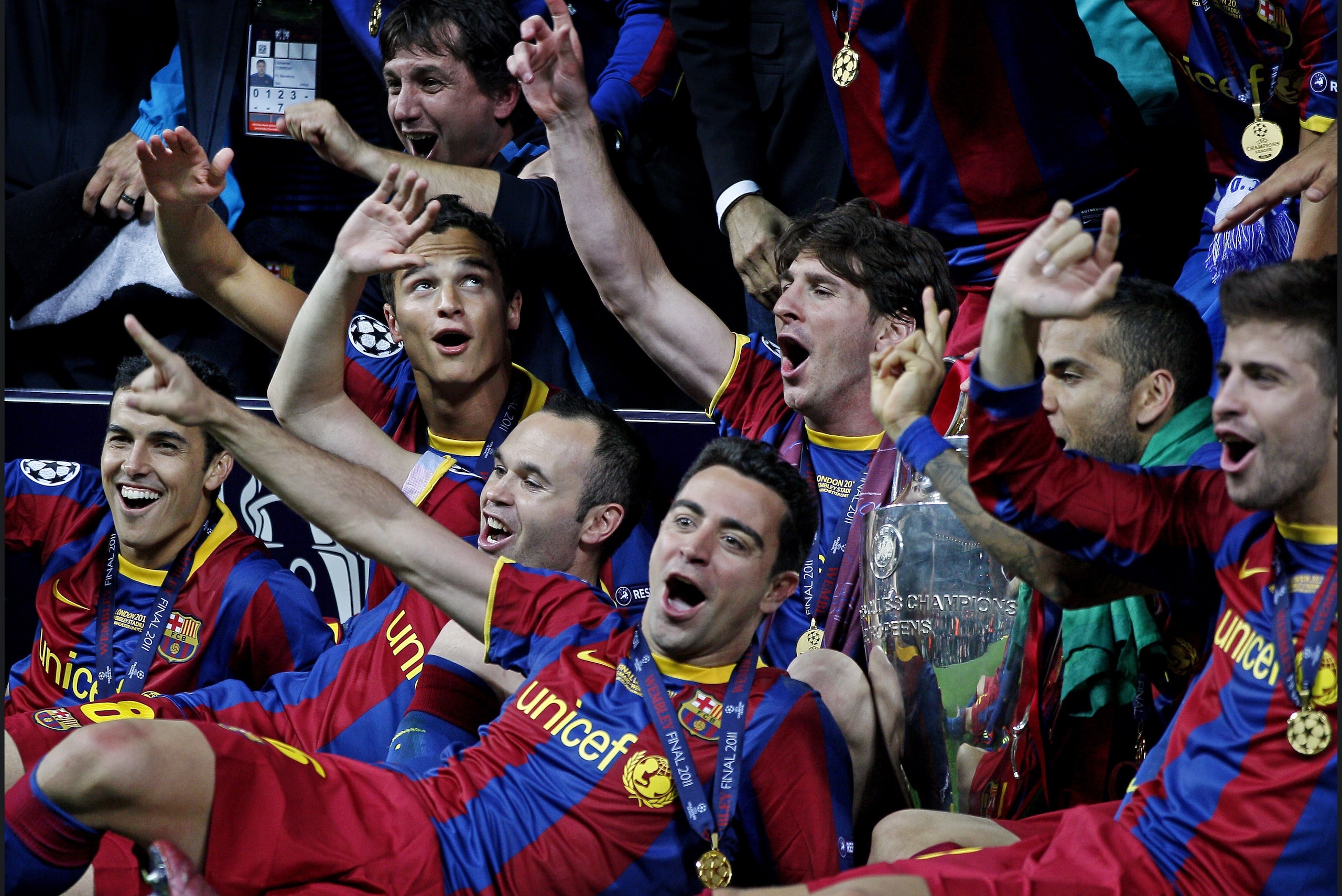 (L-R) Ibrahim Affelay,Andre Iniesta,Xavi Hernandez,Lionel Messi,Daniel Alves,Pique Celebrate with the trophy after the UEFA Champions League final between FC Barcelona and Manchester United FC at Wembley Stadium on May 28, 2011 in London, England.  (Photo