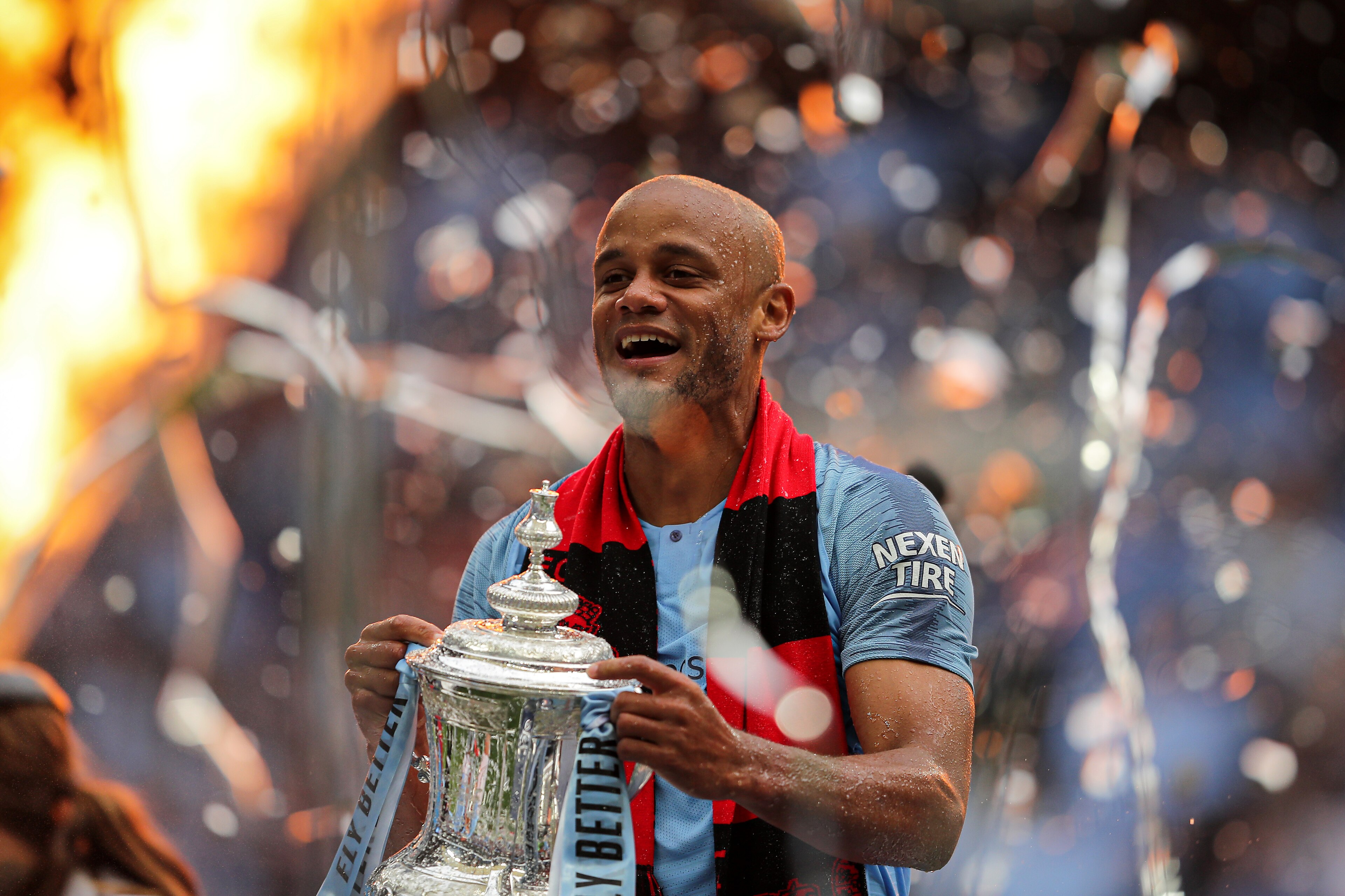 LONDON, ENGLAND - MAY 18: Vincent Kompany of Manchester City lifts the trophy following the FA Cup Final match between Manchester City and Watford at Wembley Stadium on May 18, 2019 in London, England. (Photo by Richard Heathcote/Getty Images)