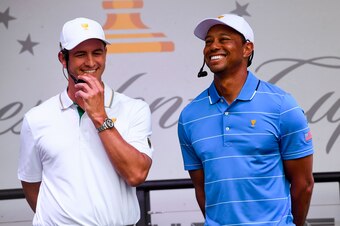 International team player Adam Scott of Australia (L) enjoys a lighter moment with Tiger Woods, captain of the US team (R) at the launch of the Presidents Cup golf tournament in Melbourne on December 9, 2019. - The Presidents Cup is to be played at the Ro