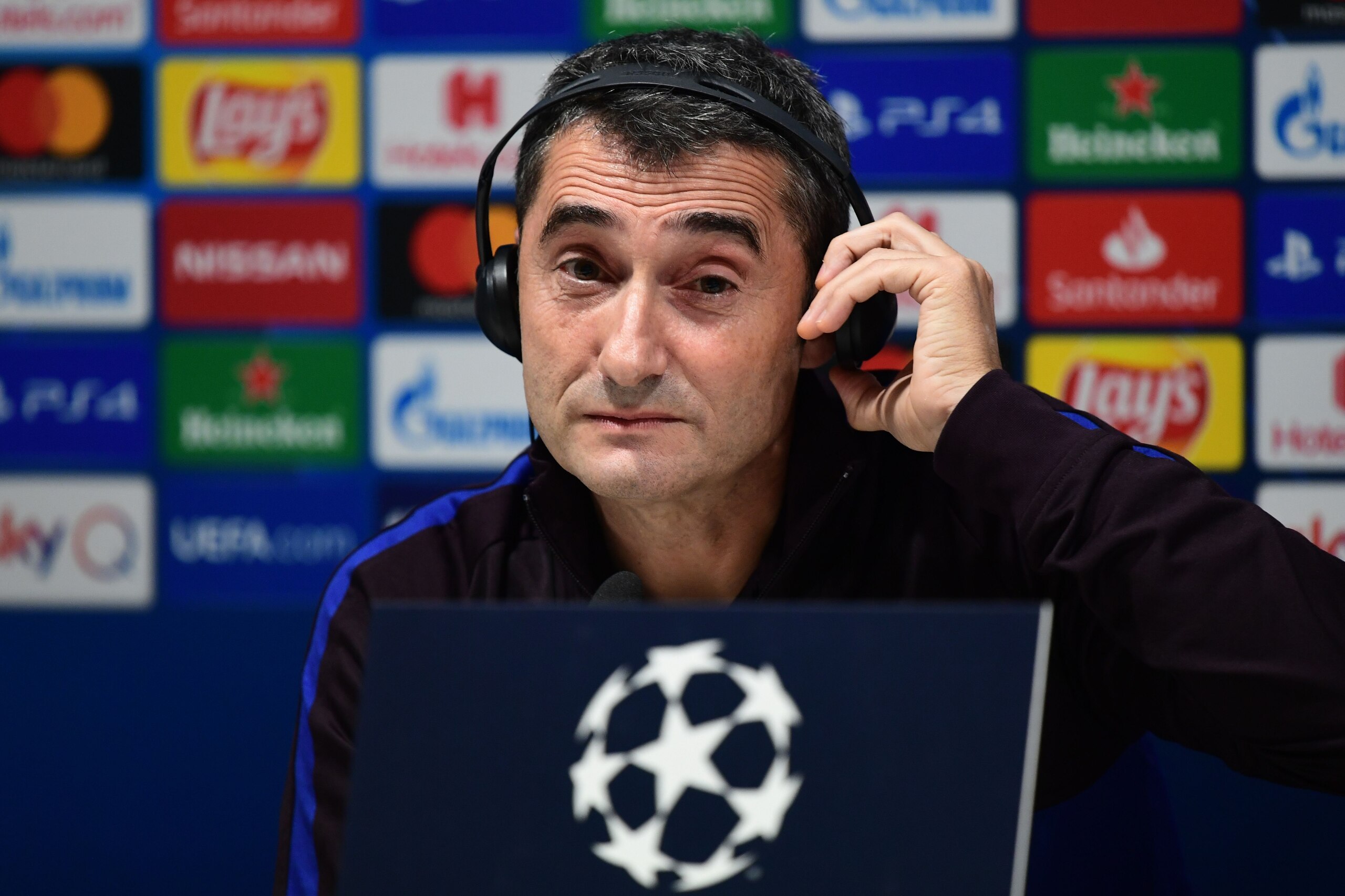 Barcelona's Spanish coach Ernesto Valverde listens during a press conference on December 9, 2019 at the San Siro stadium in Milan, on the eve of the UEFA Champions League Group F football match Inter Milan vs Barcelona. (Photo by Miguel MEDINA / AFP) (Pho