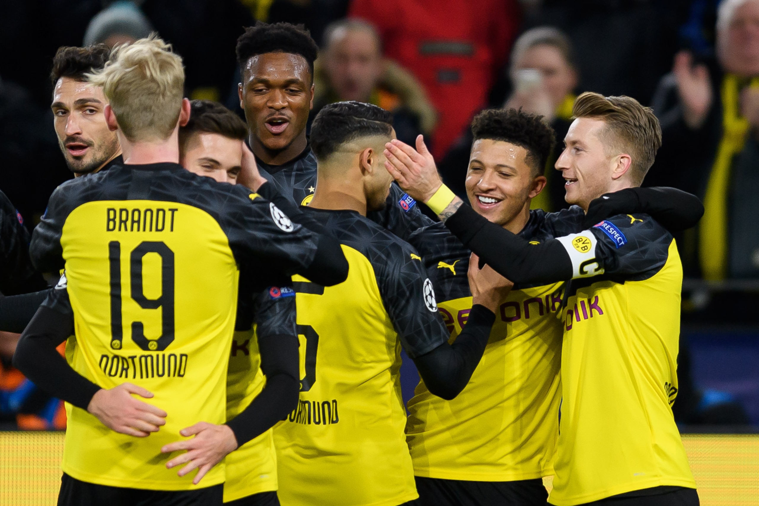DORTMUND, GERMANY - DECEMBER 10: (BILD ZEITUNG OUT) Jadon Sancho of Borussia Dortmund celebrates after scoring his team's first goal with team mates during the UEFA Champions League group F match between Borussia Dortmund and Slavia Praha at Signal Iduna 
