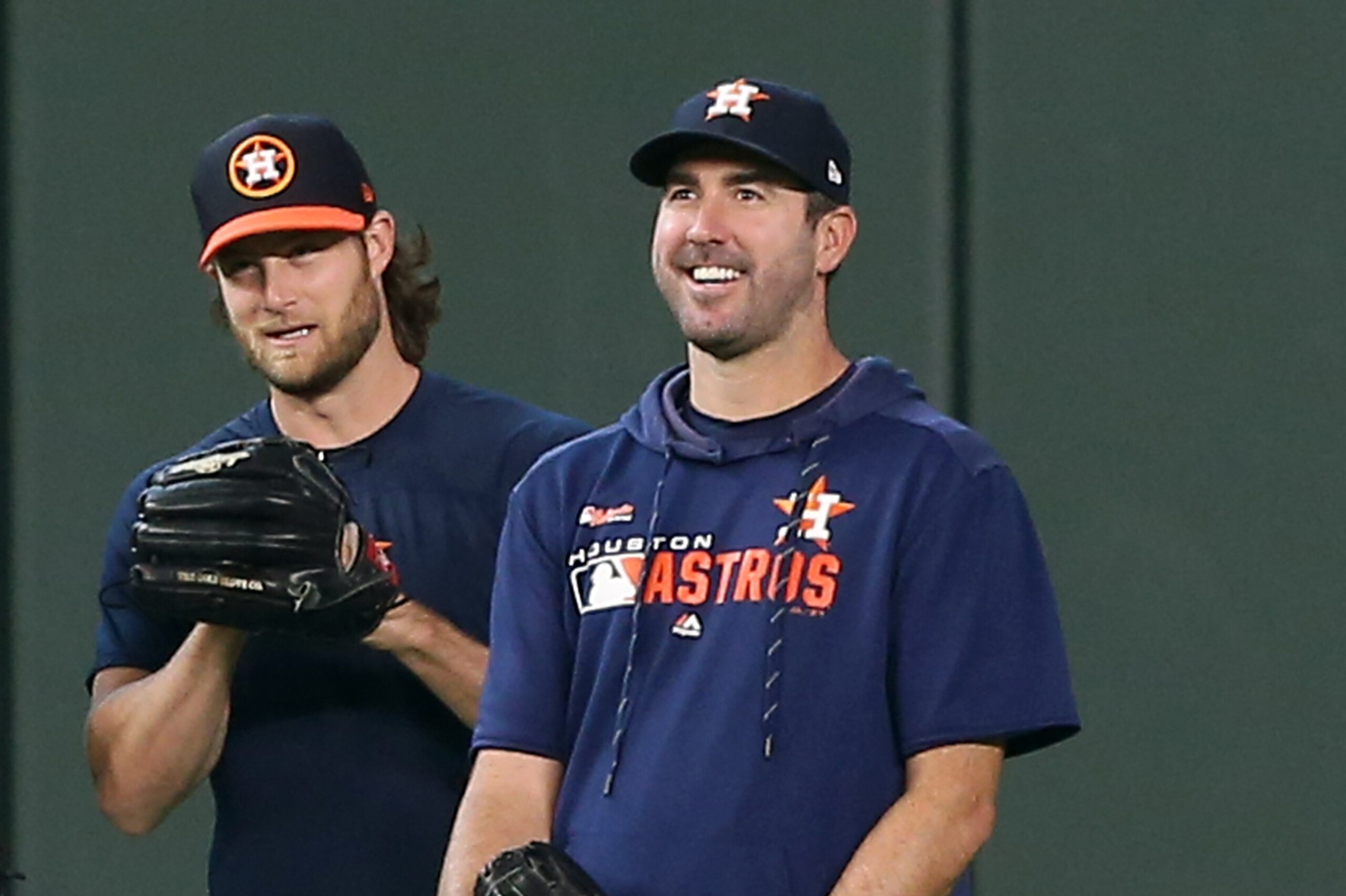 HOUSTON, TEXAS - AUGUST 03: (L-R) Wade Miley #20 of the Houston Astros, Joe Smith #38, Gerrit Cole #45 and Justin Verlander #35 chat during batting practice before a game against the Seattle Mariners at Minute Maid Park on August 03, 2019 in Houston, Texa