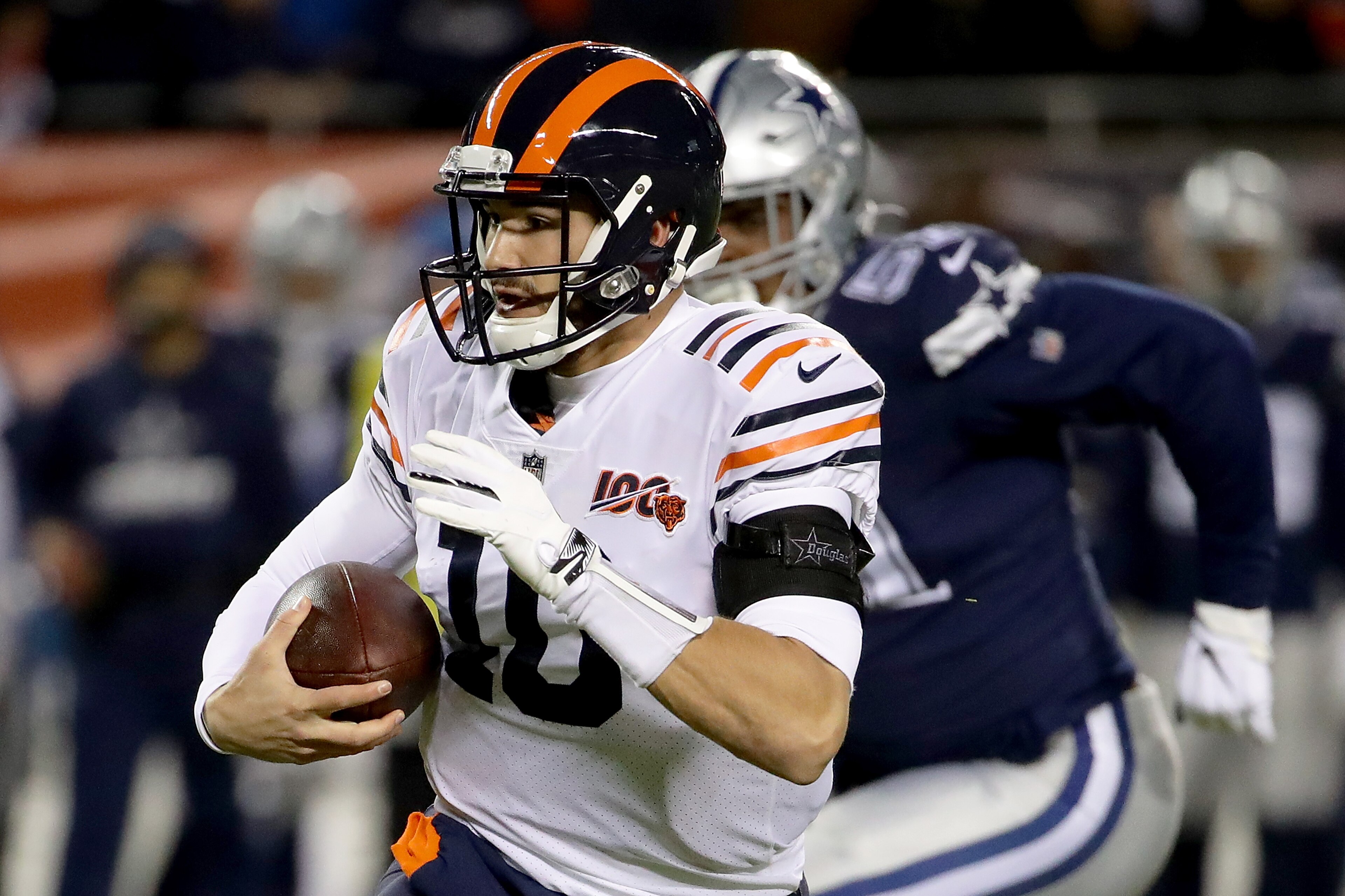 CHICAGO, ILLINOIS - DECEMBER 05: Quarterback Mitchell Trubisky #10 of the Chicago Bears runs against the defense of defensive end Kerry Hyder #51 of the Dallas Cowboys during the game at Soldier Field on December 05, 2019 in Chicago, Illinois. (Photo by J