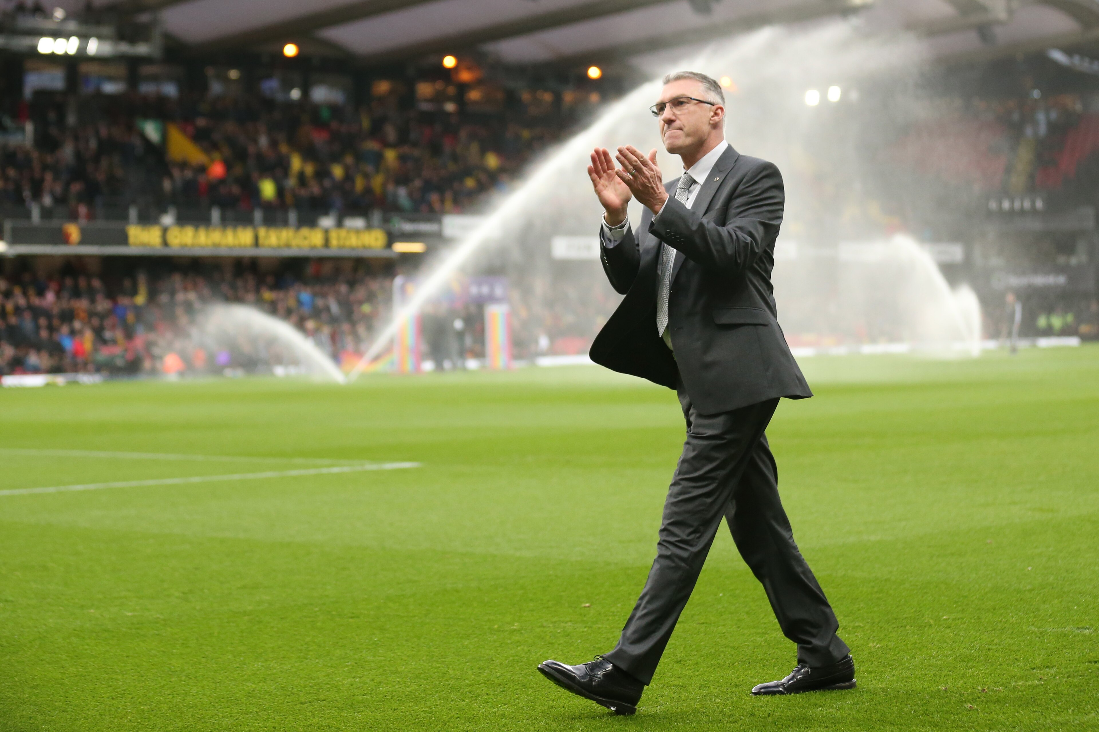 WATFORD, ENGLAND - DECEMBER 07: Newly appointed Watford FC manager Nigel Pearson acknowledges the fans as he attends the Premier League match between Watford FC and Crystal Palace at Vicarage Road on December 07, 2019 in Watford, United Kingdom. (Photo by