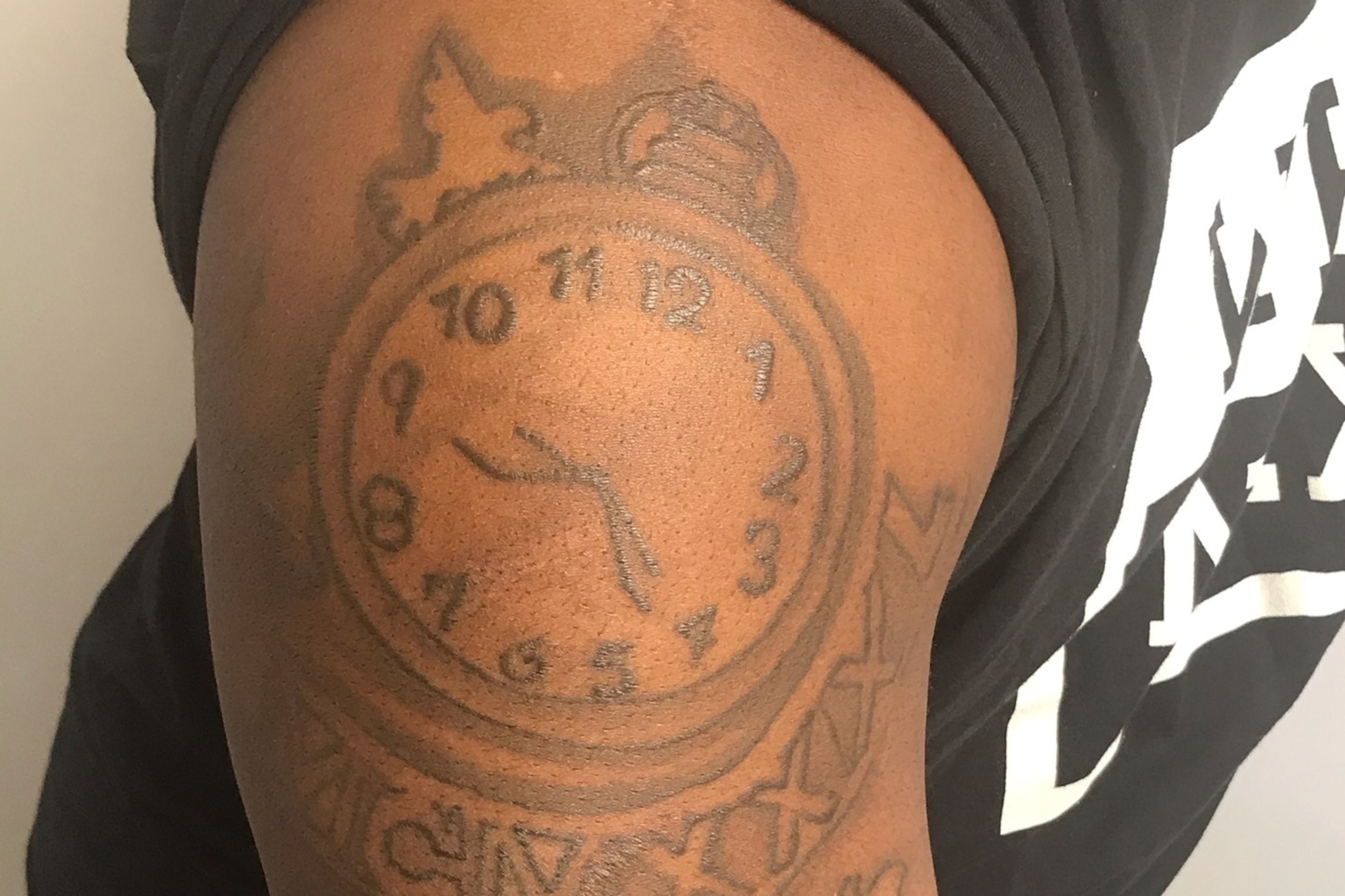 The tattoo of a clock set to his cousin's birth date reminds Antwain how important his relative was in helping him grow up.