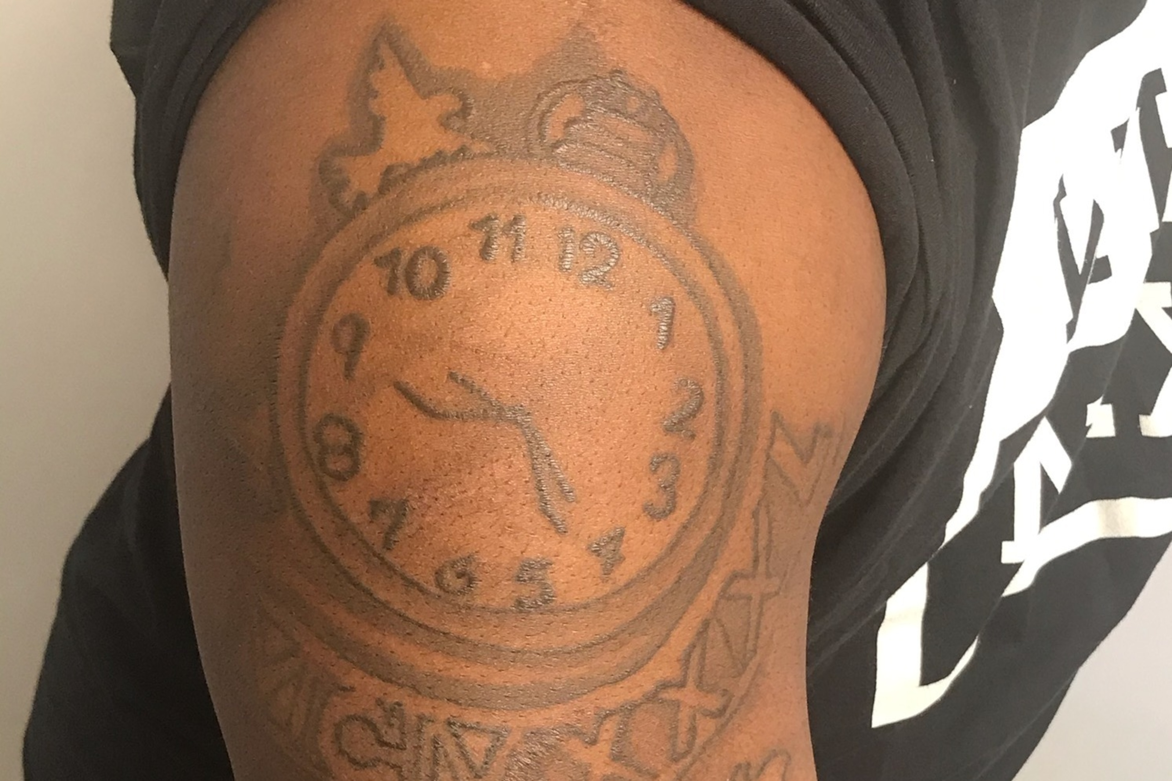 The tattoo of a clock set to his cousin's birth date reminds Antwain how important his relative was in helping him grow up. The tattoo of a clock set to his cousin's birth date reminds Antwain how important his relative was in helping him grow up.
