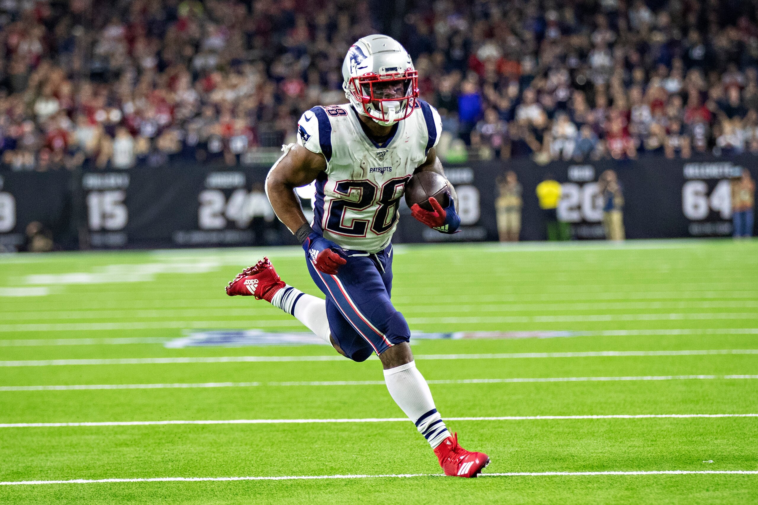 HOUSTON, TX - DECEMBER 1:  James White #28 of the New England Patriots runs in for a touchdown during the second half of a game against the Houston Texans at NRG Stadium on December 1, 2019 in Houston, Texas.  The Texans defeated the Patriots 28-22.  (Pho