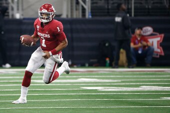 ARLINGTON, TX - DECEMBER 07: Jalen Hurts #1 of the Oklahoma Sooners runs the ball against the Baylor Bears in the fourth quarter of the Big 12 Football Championship at AT&T Stadium on December 7, 2019 in Arlington, Texas. Oklahoma won 30-23. (Photo by Ron