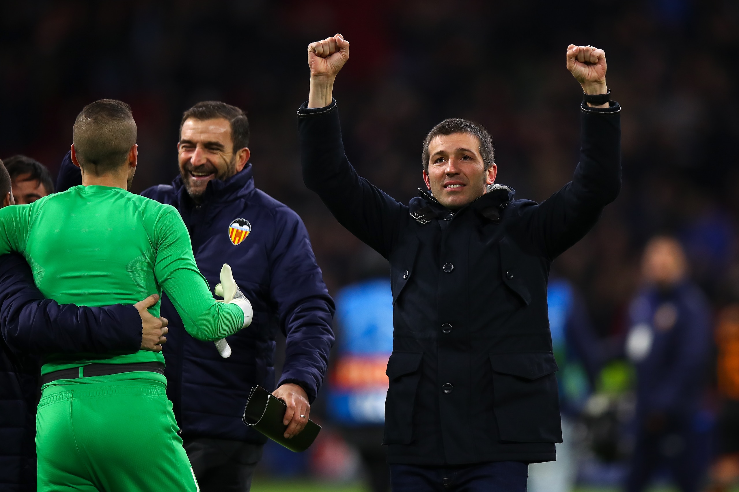 AMSTERDAM, NETHERLANDS - DECEMBER 10: Albert Celades the head coach / manager of Valencia CF celebrates with the fans at full time during the UEFA Champions League group H match between AFC Ajax and Valencia CF at Amsterdam Arena on December 10, 2019 in AMSTERDAM, NETHERLANDS - DECEMBER 10: Albert Celades the head coach / manager of Valencia CF celebrates with the fans at full time during the UEFA Champions League group H match between AFC Ajax and Valencia CF at Amsterdam Arena on December 10, 2019 in