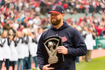 CLEVELAND, OH - APRIL 6: Corey Kluber #28 of the Cleveland Indians receives his 2017 Cy Young award prior to the game against the Kansas City Royals at Progressive Field on April 6, 2018 in Cleveland, Ohio. The Indians defeated the Royals 3-2. (Photo by J