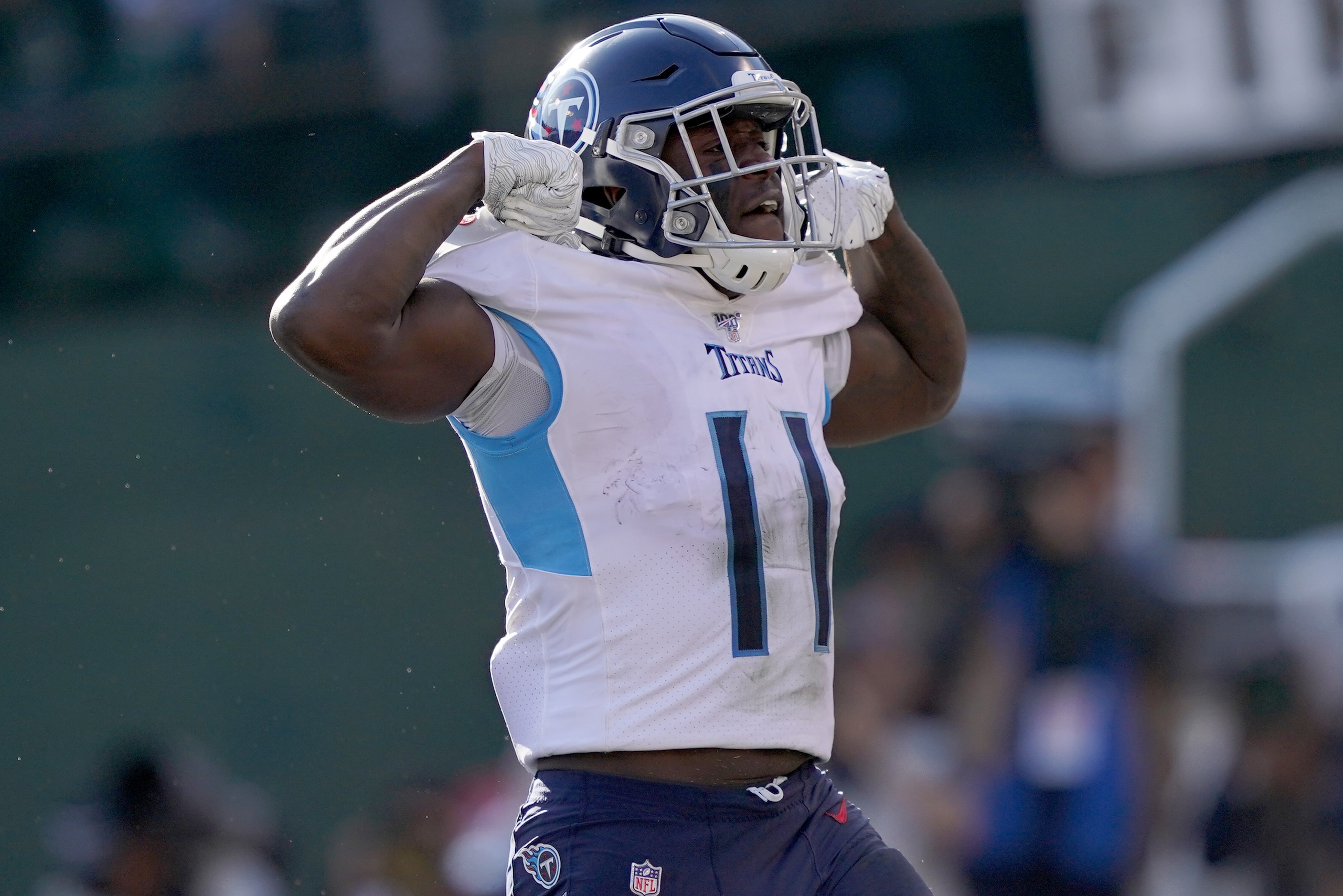 OAKLAND, CALIFORNIA - DECEMBER 08: A.J. Brown #11 of the Tennessee Titans celebrates after he scored a touchdown against the Oakland Raiders during the first half of an NFL football game at RingCentral Coliseum on December 08, 2019 in Oakland, California.