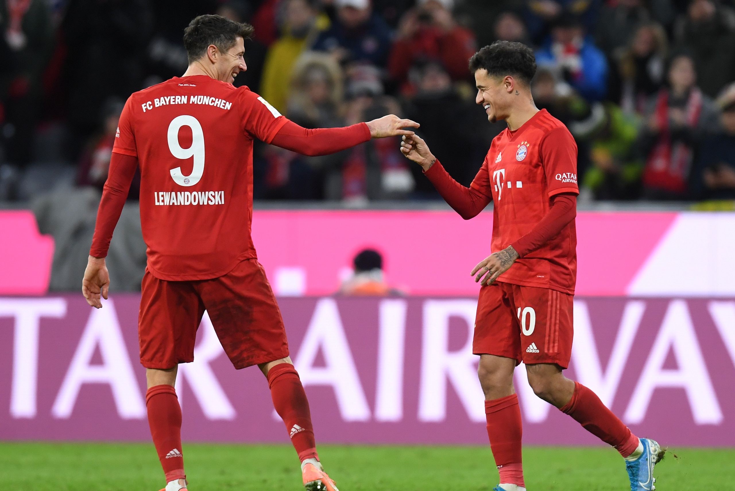 Bayern Munich's Brazilian midfielder Philippe Coutinho (R) and Bayern Munich's Polish forward Robert Lewandowski (L) react after the third goal of Philippe Coutinho during the German first division Bundesliga football match Bayern Munich v Werder Bremen i Bayern Munich's Brazilian midfielder Philippe Coutinho (R) and Bayern Munich's Polish forward Robert Lewandowski (L) react after the third goal of Philippe Coutinho during the German first division Bundesliga football match Bayern Munich v Werder Bremen i
